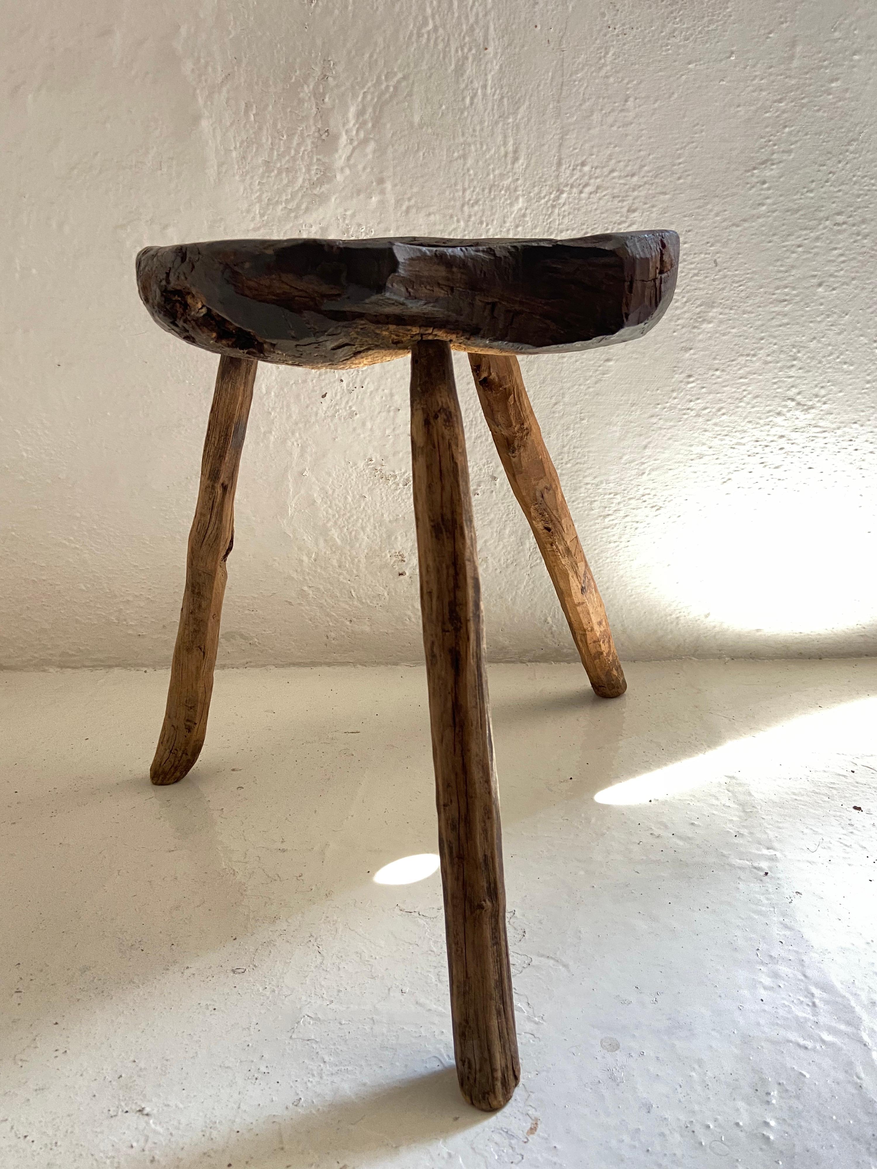 19th century hardwood stool from San Luis Potosí, Mexico. This piece is primitive in style. Much wear is evident throughout the seat. All original legs. Rare piece.