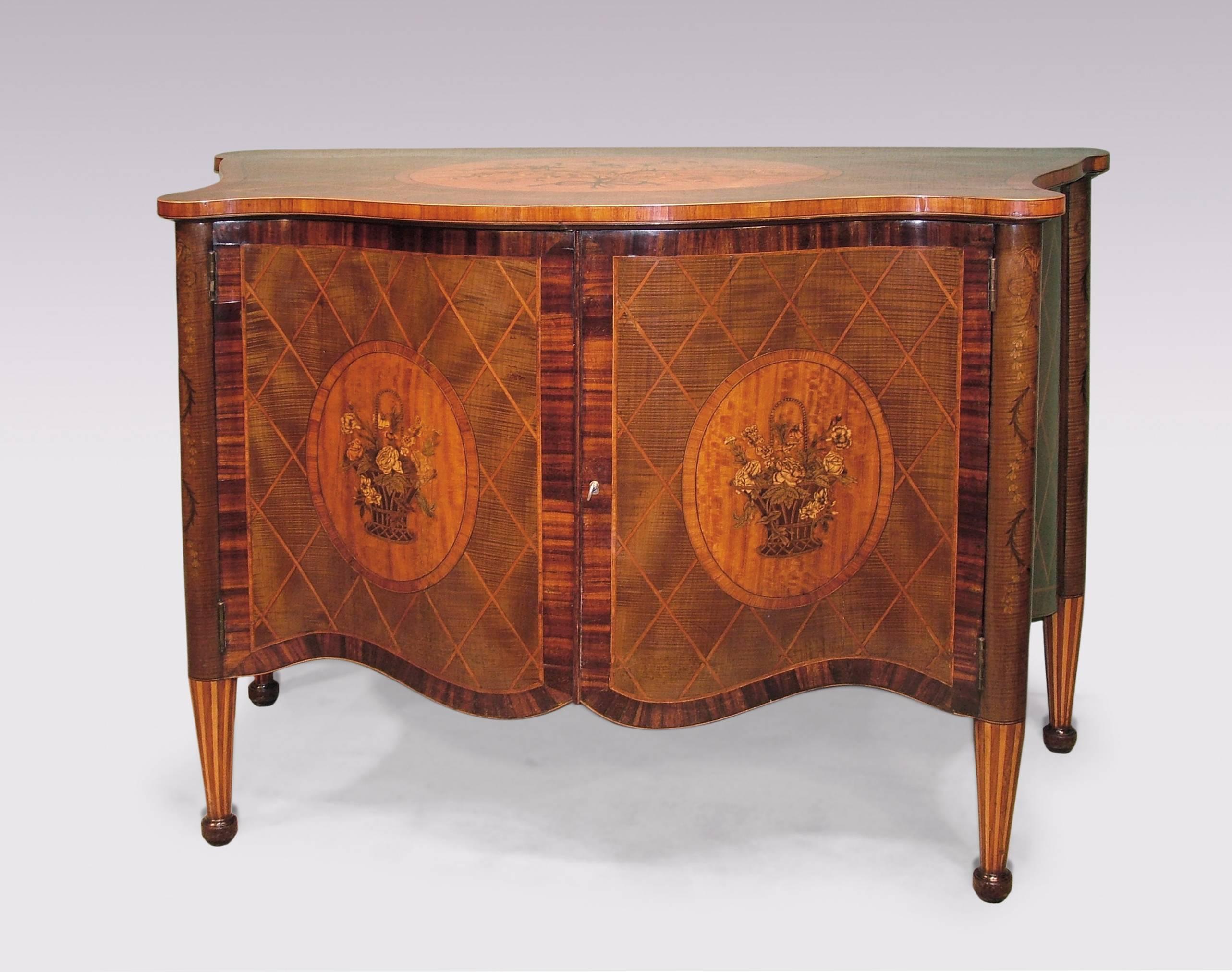 A fine 19th century harewood and diamond lattice-work serpentine commode in the mid-18th century style, having tulipwood crossbanded top with inset oval satinwood floral marquetry inlaid satinwood panel above shaped doors with similar panels inlaid