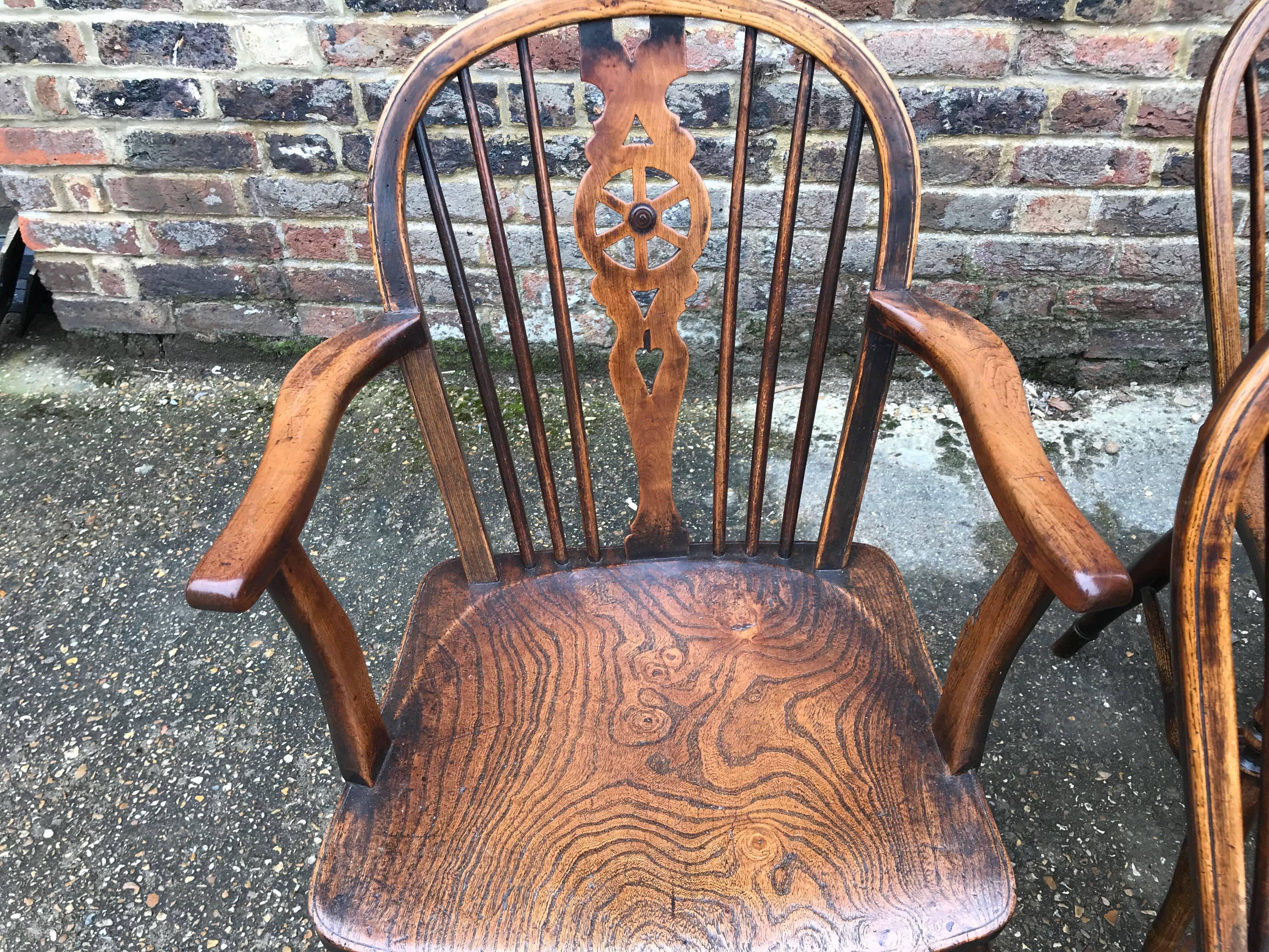 British 19th Century Harlequin Set of Eight Wheel Back Windsor Chairs