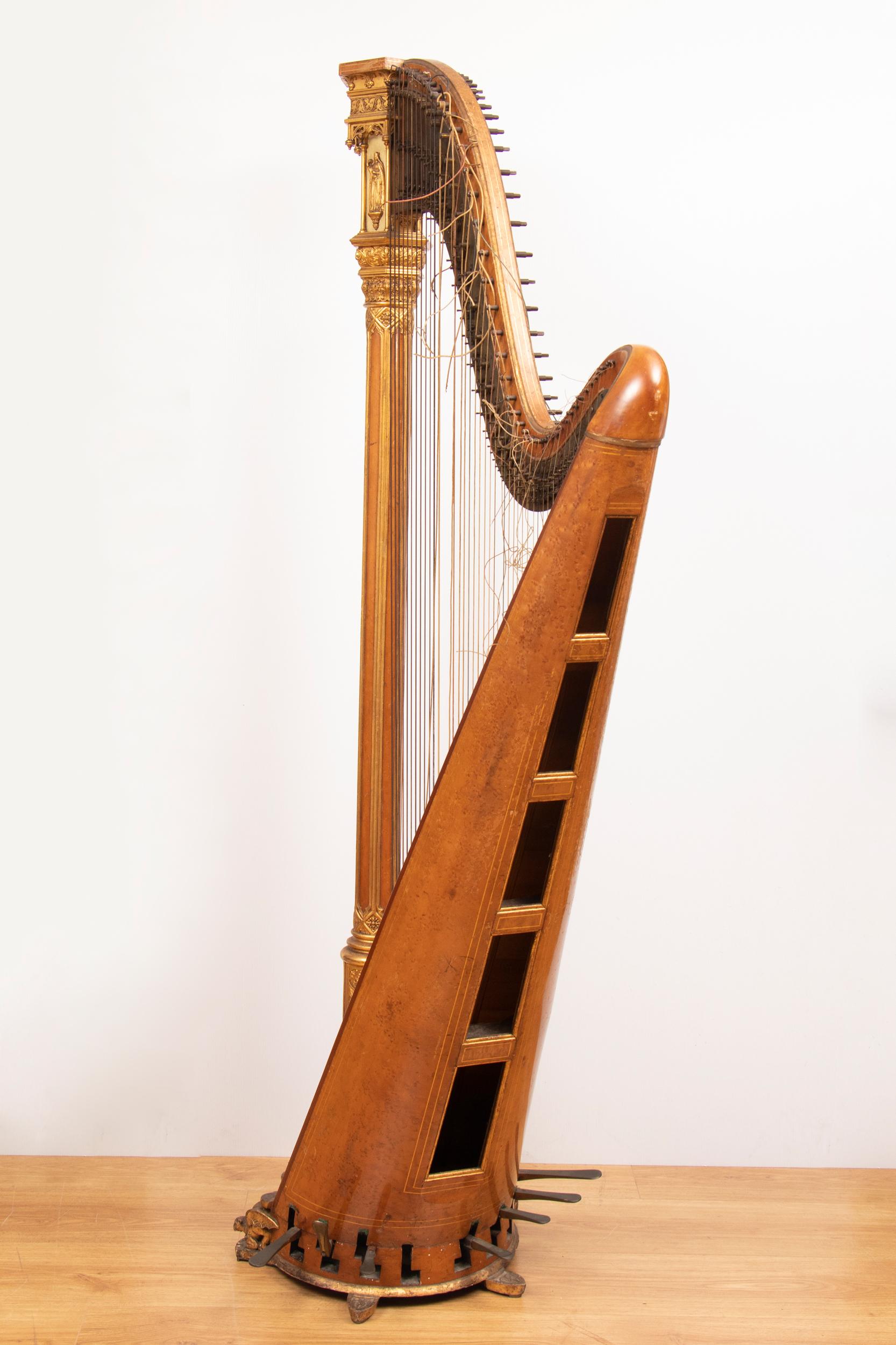 Harp by Sébastien Érard. Intricate gothic detail with winged beasts to the base and religious figures at the top. Played until 20 years ago, it has remained in the same family for many years. It would need restoration to be played again but is an