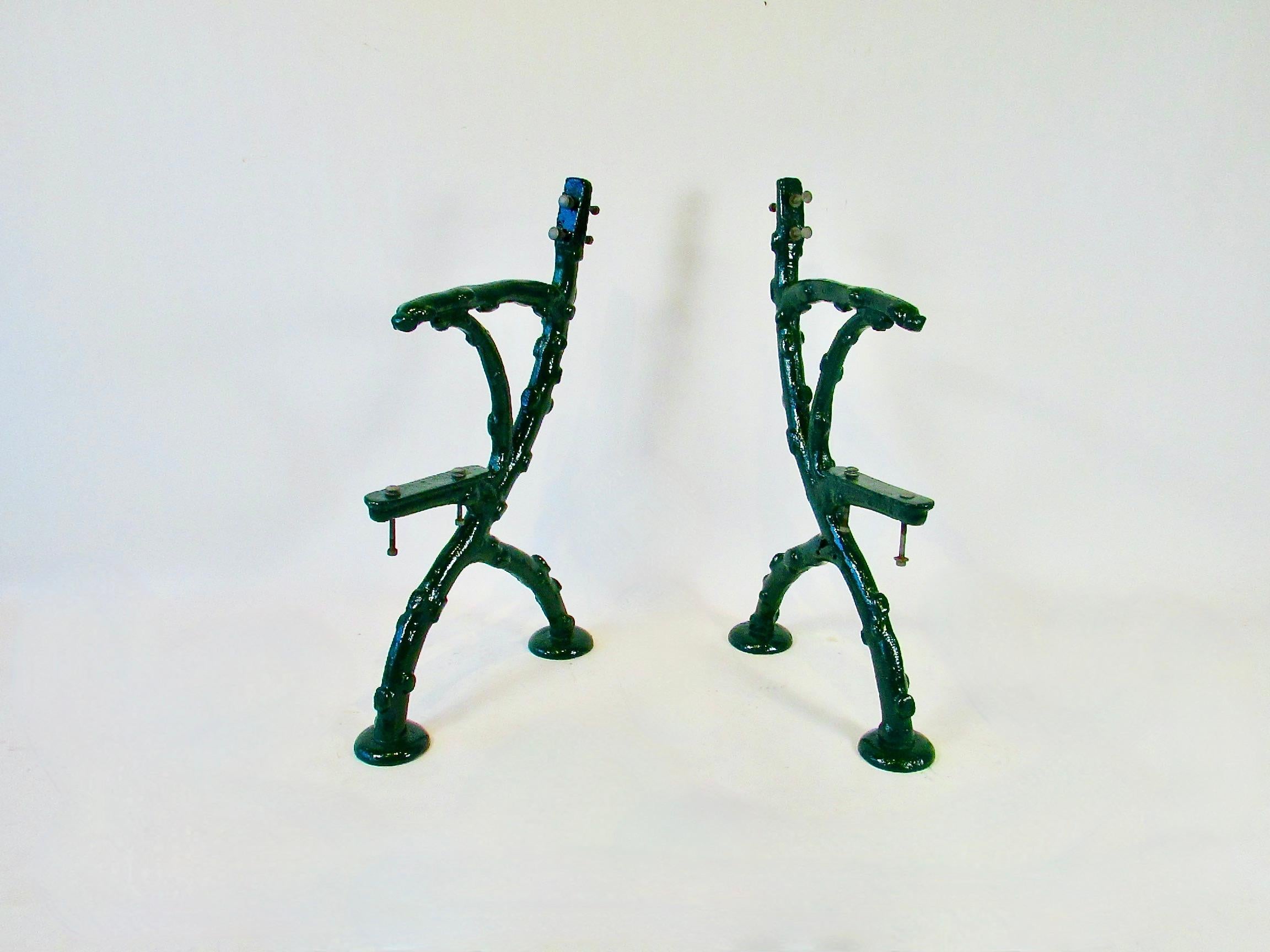Heavy cast iron garden bench frames . Faux bois style of knotty tree branches . Saved from a Detroit area estate . Original wood was rotted beyond saving . Benches were media blasted and powder coated in a gloss hunter green finish . Each measure