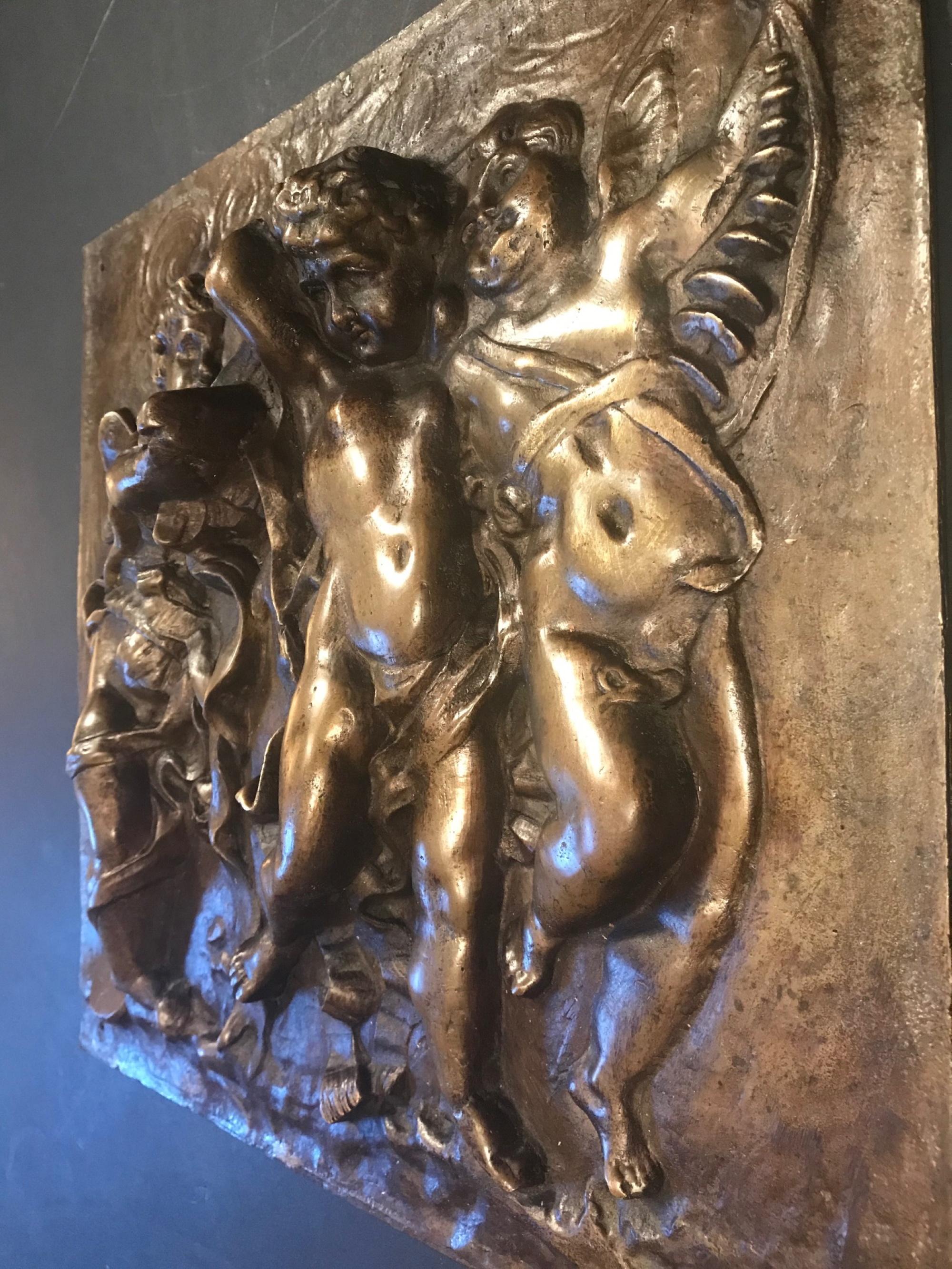19th century heavy French bronze relief plaque of 3 putti with instruments.

This heavy and beautiful 19th century French bronze plaque features three winged, dancing putti with ribbons and a glockenspiel, an accordion and a tambourine. The
