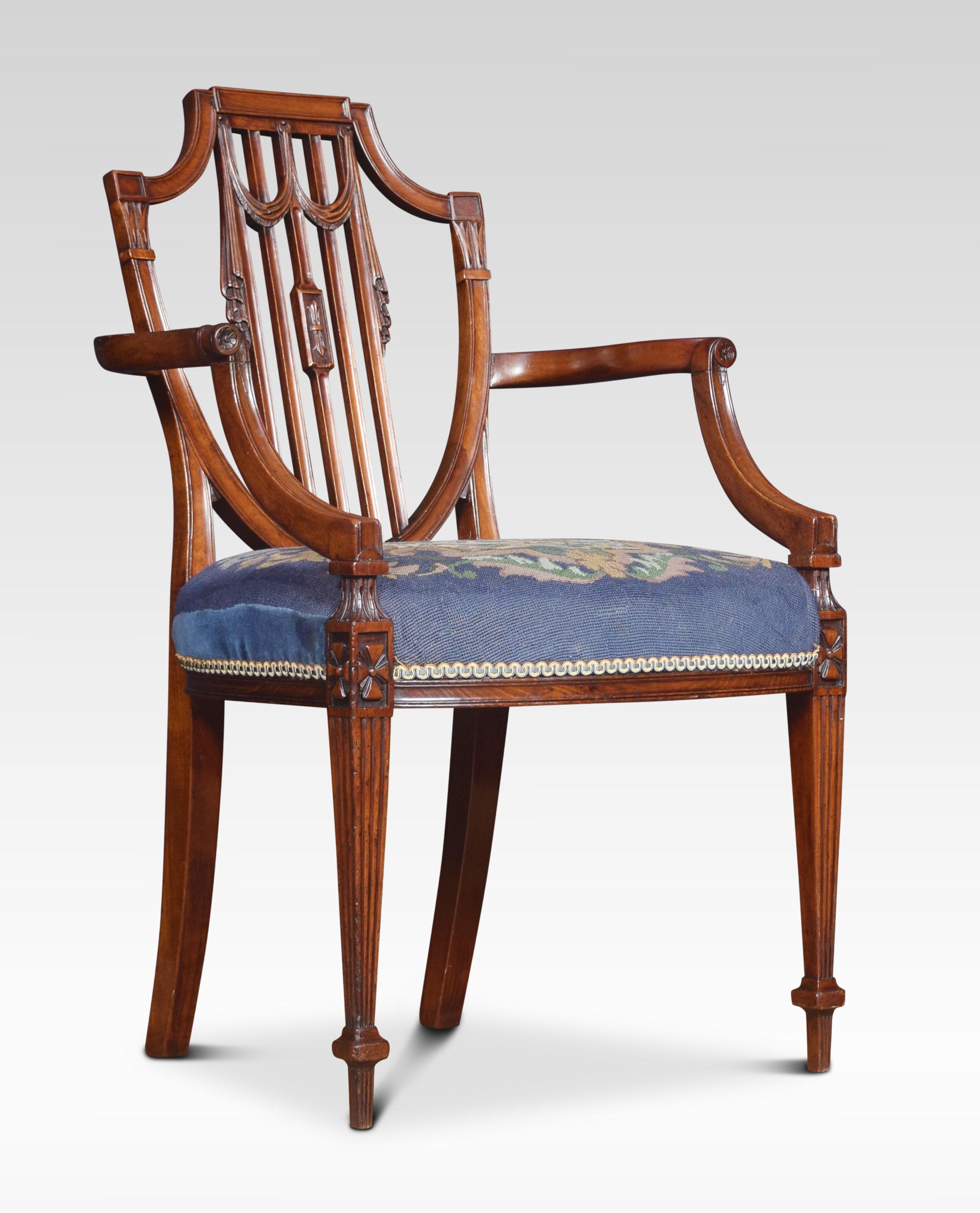 19th century Hepplewhite design mahogany armchair with carved and reeded decoration the shield shape backrest over a needlepoint seat. All raised up on square tapering legs.
Dimensions:
Height 37 inches height to seat 19.5 inches
Width 23