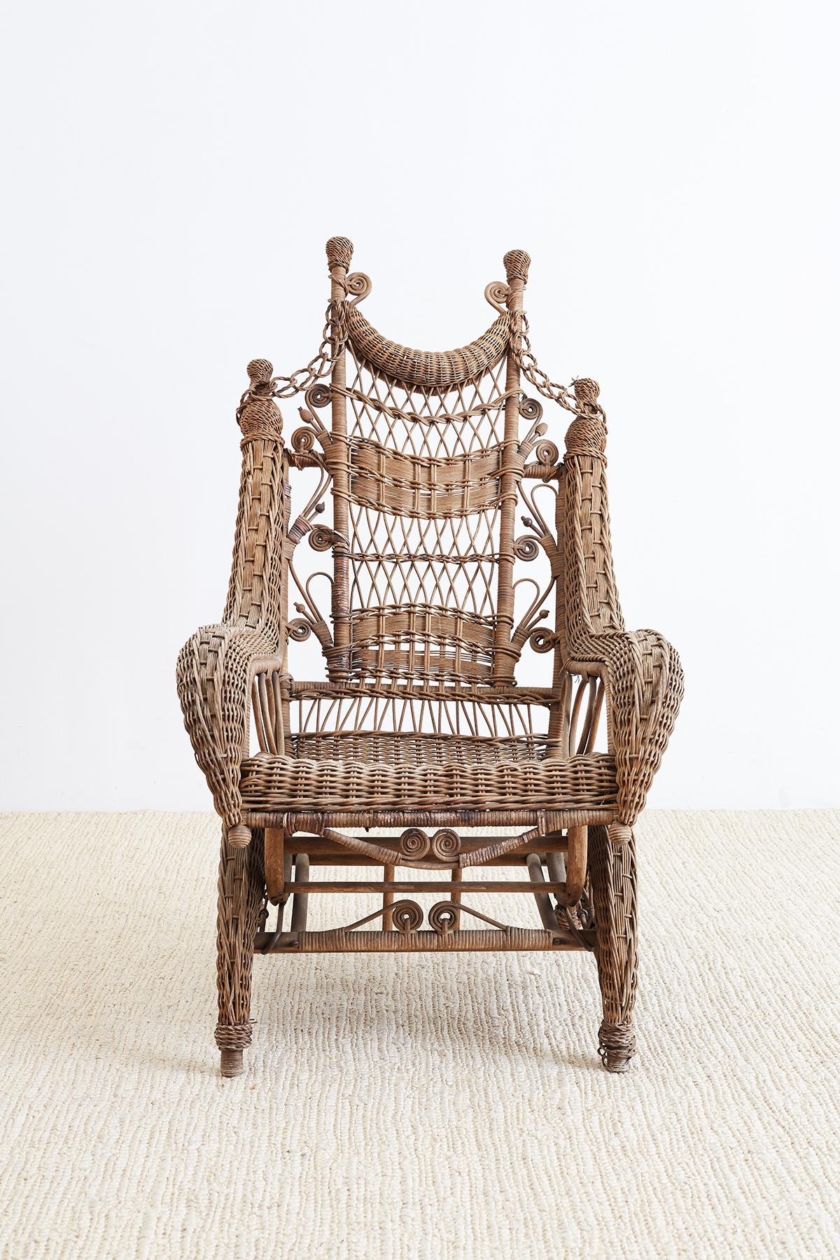 Late 19th century Victorian wicker platform rocker made by Heywood Brothers who eventually became the Heywood Wakefield Company. Unique fluid design with Art Nouveau influences. Constructed with delicate fancy work decorative scrolls and chain