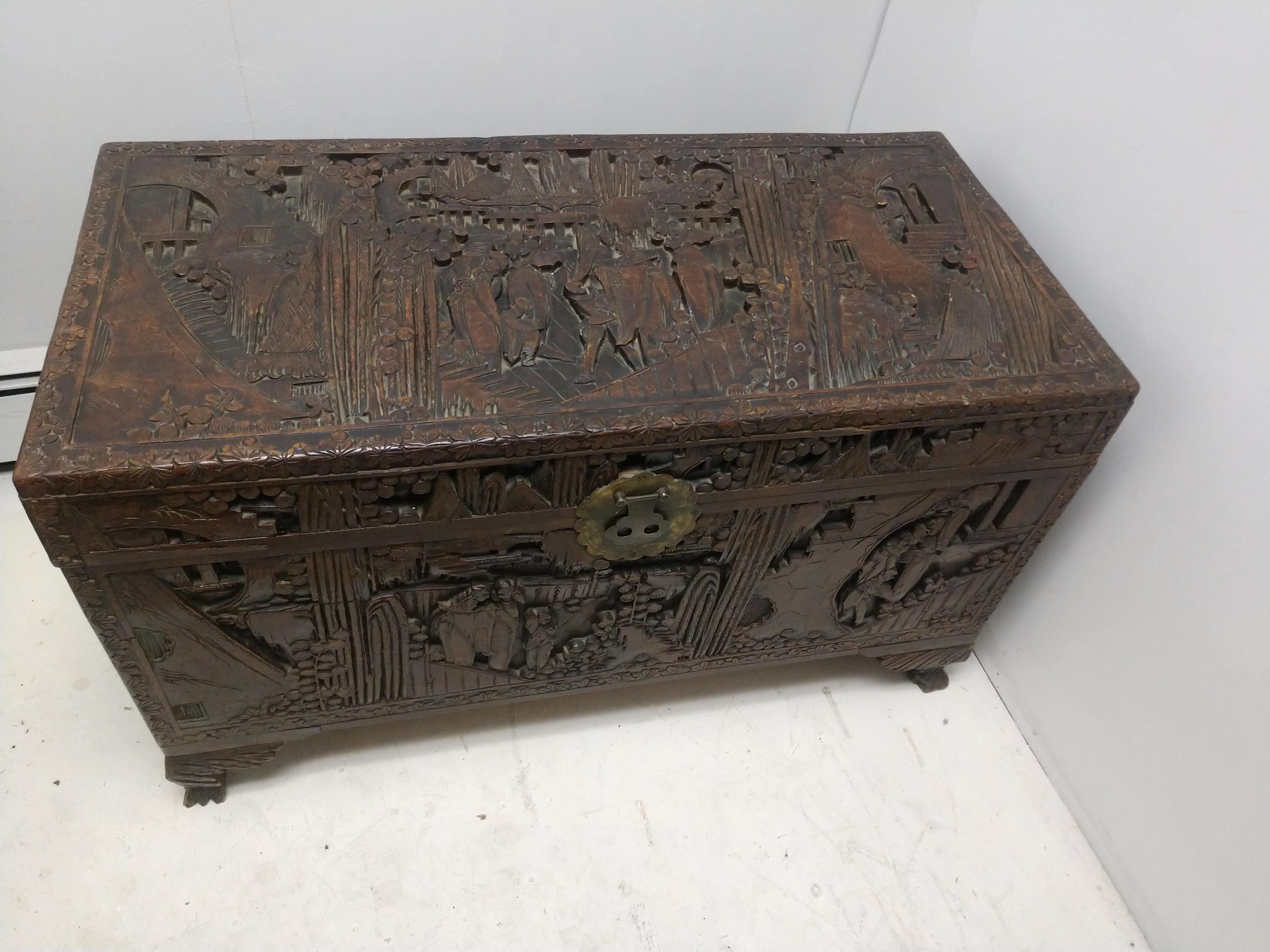 Fabulous and amazing hand carved blanket chest from 19th century, china. Carved from Camphor, and carved on all five sides with numerous scenes depicting human activities and nature.