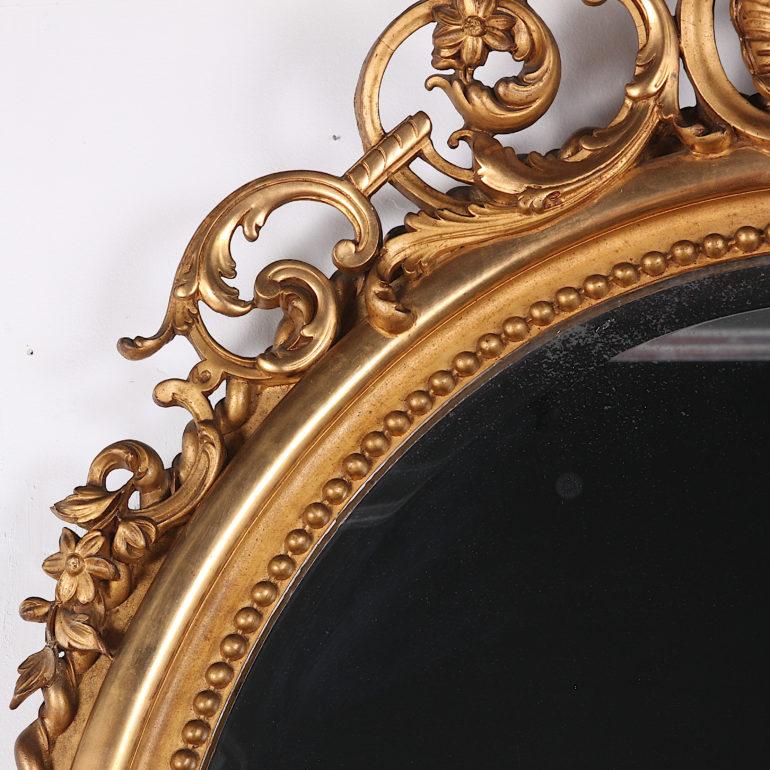 French 19th Century Highly Carved Gilt Oval Mirror