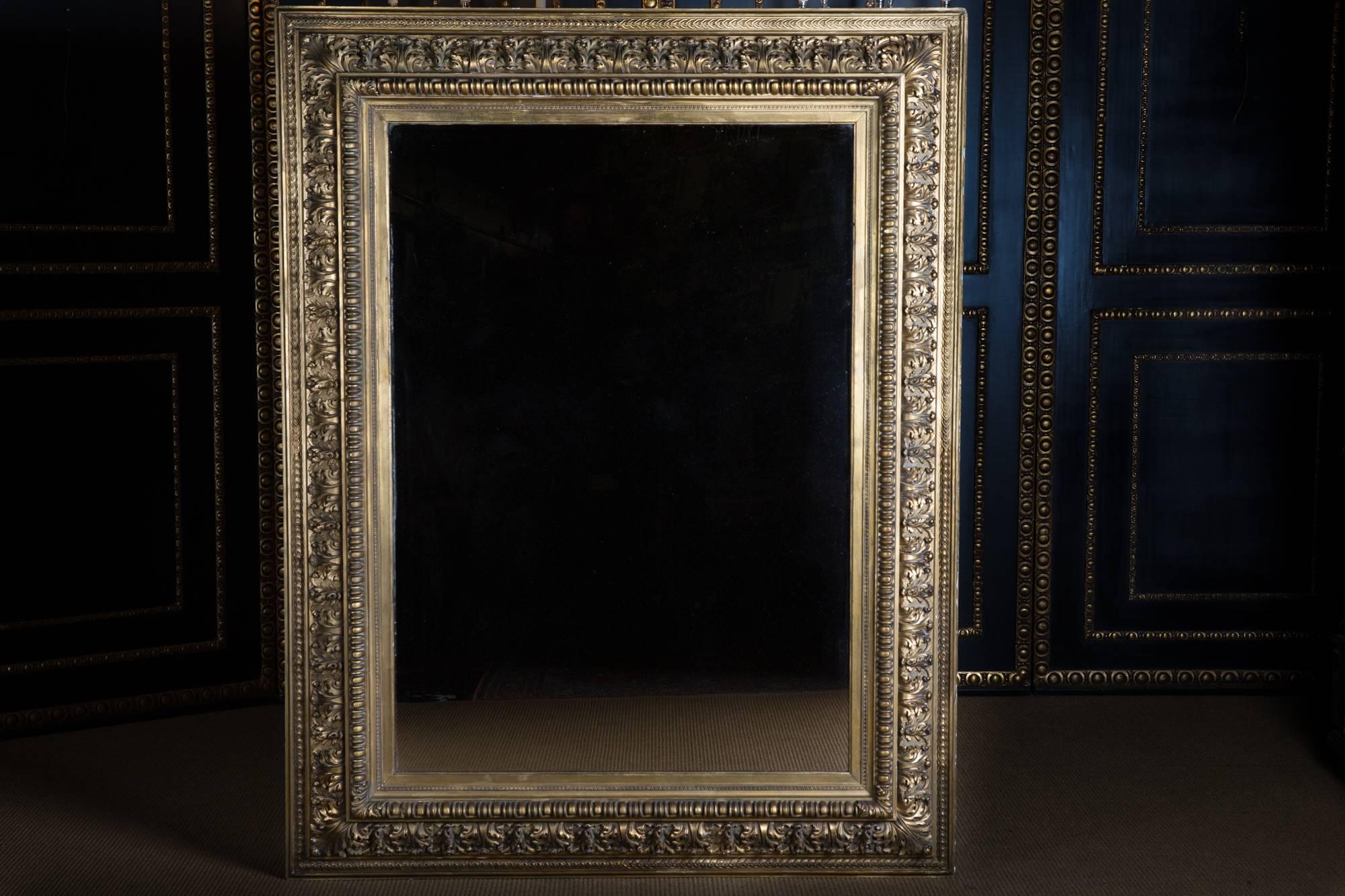 Rectangular frame, plastically profiled ornaments. The entire frame is gilded. The mirror is from the 19th century.

A good historical condition.

