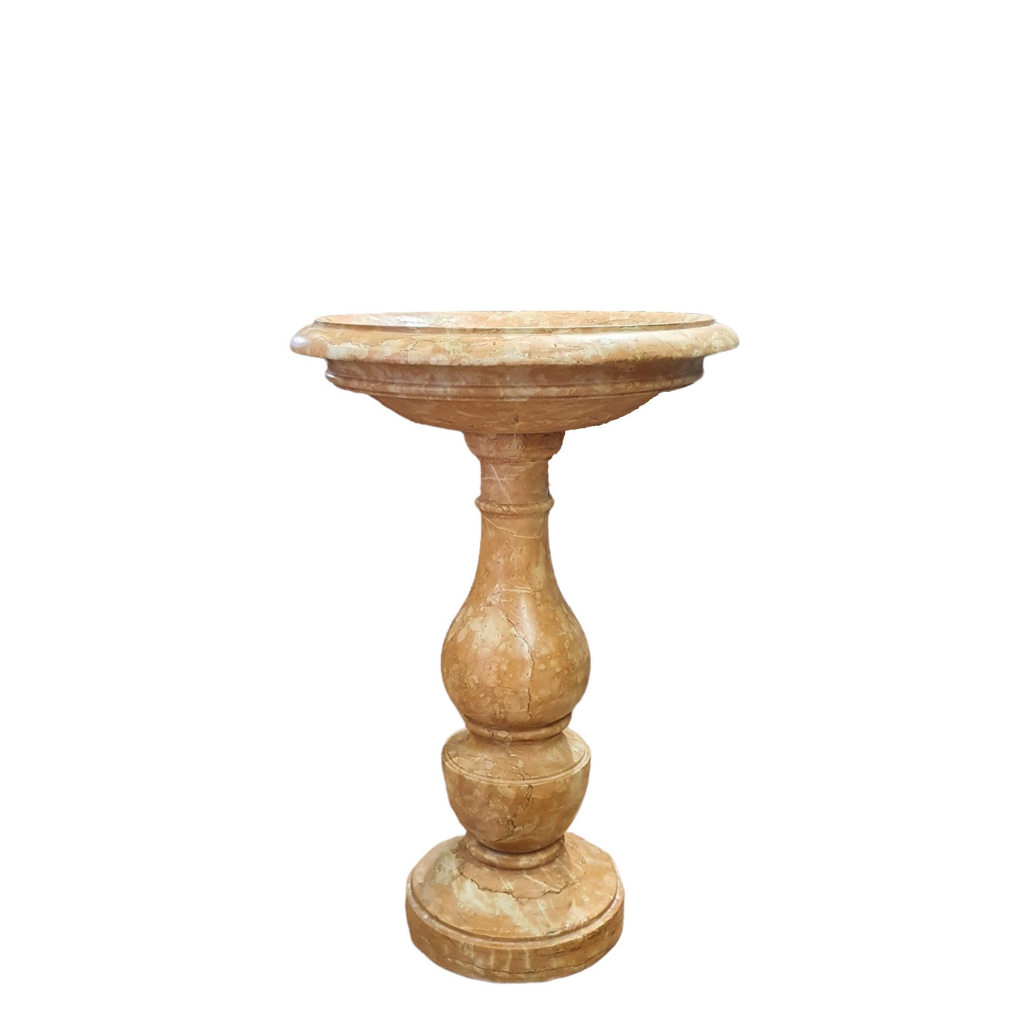 Holy water stoup in red Piana degli Albanesi marble, made in Sicily at the end of the 19th century.
