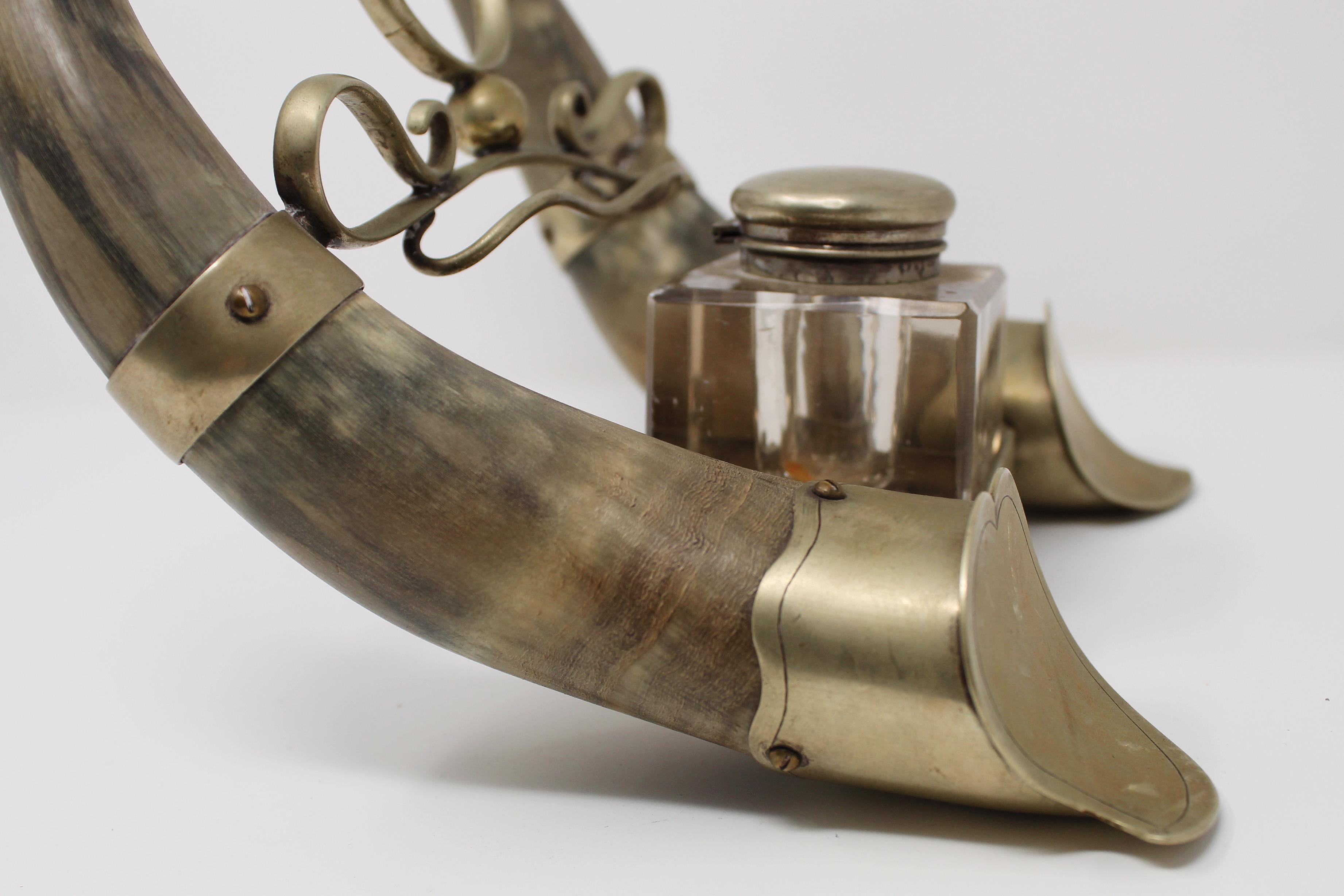 Incredible late 19th century inkwell, two horns and mounted pewter and brass fittings, a stunning combination.

The large inkwell is made from a substantial piece of crystal with a hinged lid, some usual wear to the plate, crystal and selling as