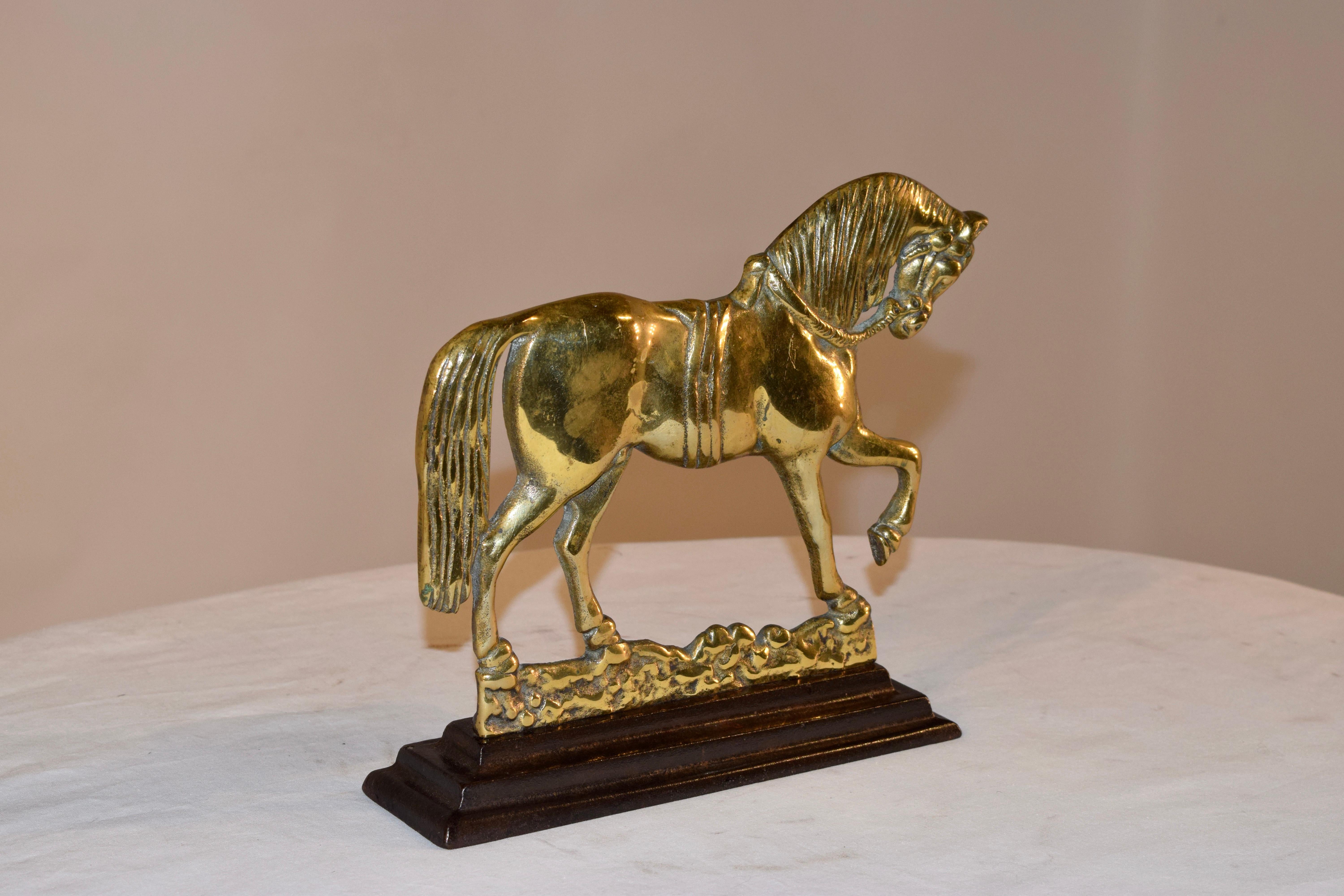 19th century horse mantle decoration from England made from hand cast brass, supported on an iron base. Great color.