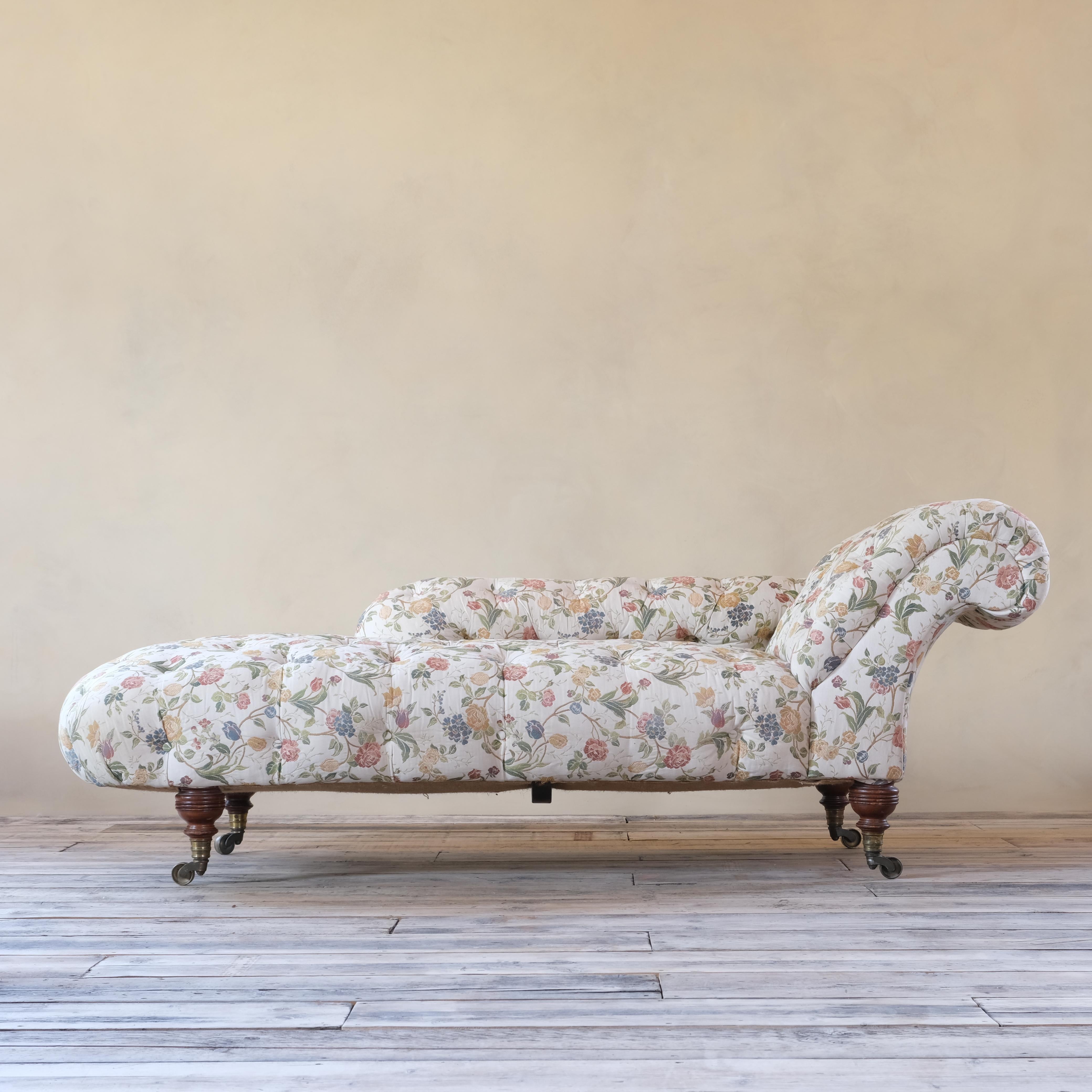A 19th century chaise lounge by Howard and sons - London. Large in scale and raised on 4 beautifully turned walnut legs with all 4 original H&S stamped ring turned gilt brass casters. 

As the upholstery is in good clean condition I have decided
