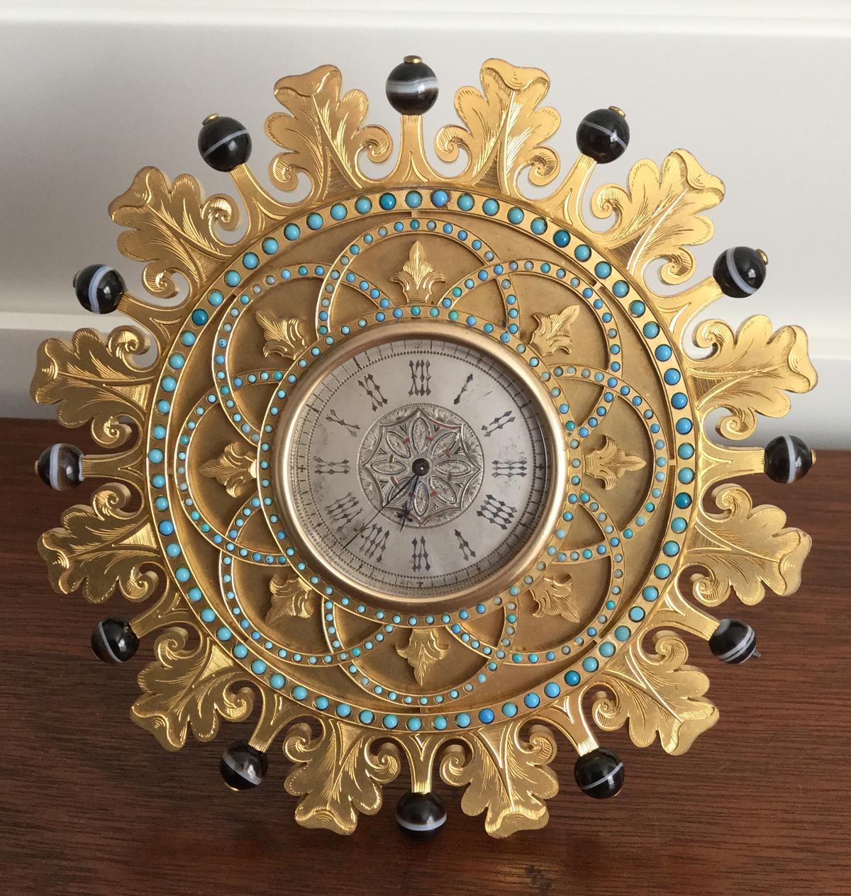 Gilt bronze strut clock - Howell James & Co, 19th century.

A beautiful petite gilt bronze sun shaped strut clock by Howell James & Co, clock makers to Queen Victoria. This clock is contained in a blue case with Dual crown ducal monograms to the