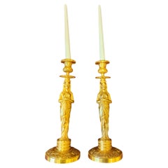 Pareja de candeleros Retour d'Egypte de bronce dorado, época Imperio, S. XIX
