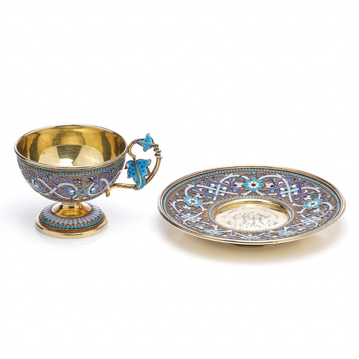 Antique late-19th century Imperial Russian solid silver-gilt and cloisonne enamel cup and saucer, each part richly gilt and beautifully enamelled with varicolor flowers, scrolling foliage, stylized floral handle and beaded blue boarders along the