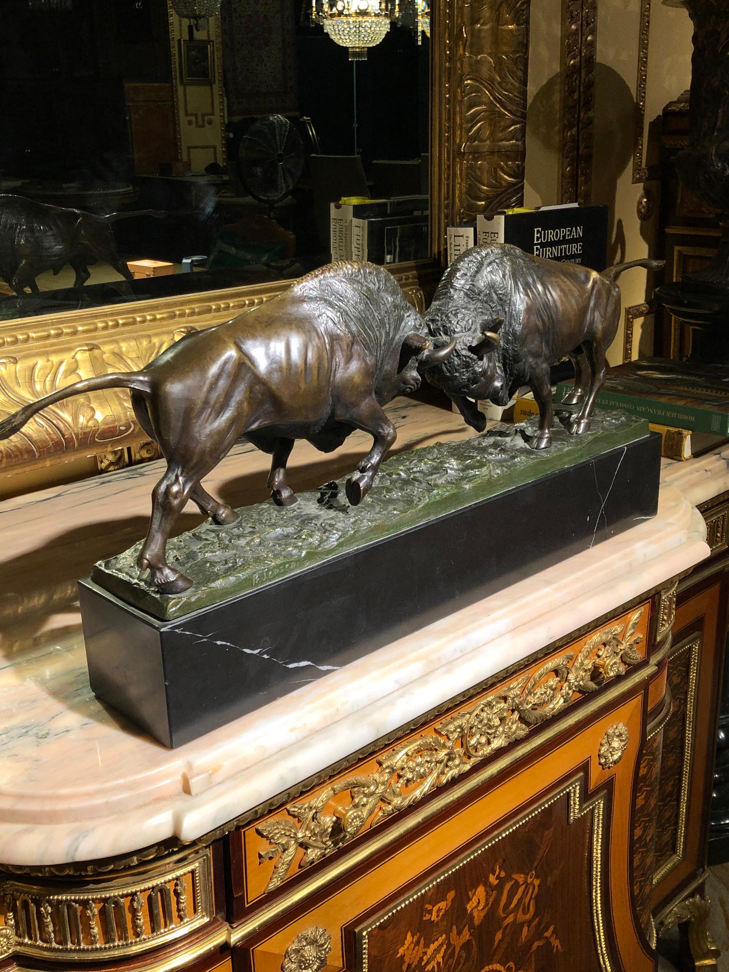 19th Century impressive bronze slave of Two fighting bisons , P. Jensen

impressive bronze slave of Two fighting bisons.
Fighting bison on tall rectangular marble pedestal. Tense posture in attack position. Bronze art castings. Extremely high