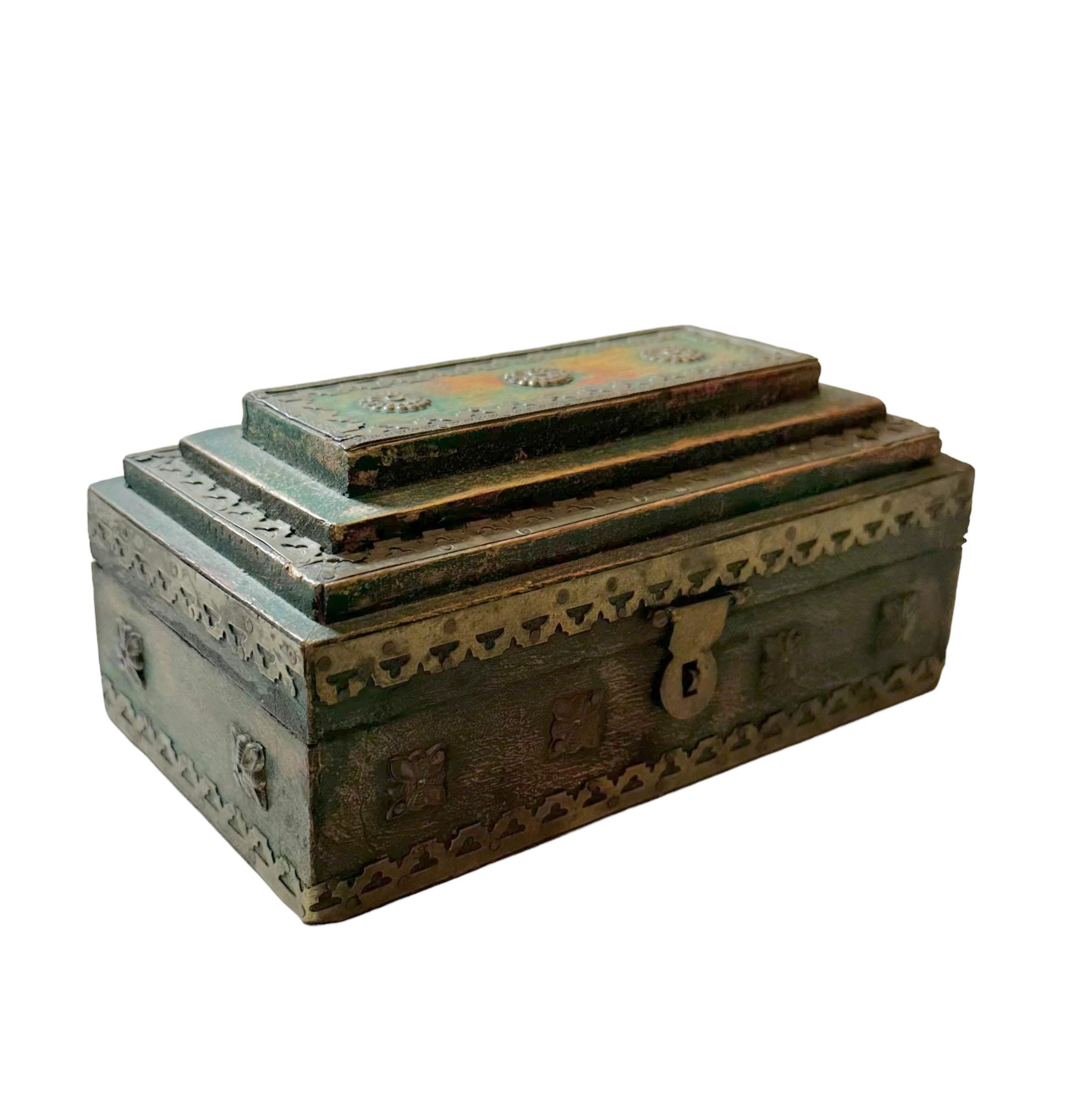 This exquisite antique box from 19th century India is a true treasure with its rich patina and traces of green paint. The brass studs add a real touch making it a genuine statement piece. The interior is one inch deep.