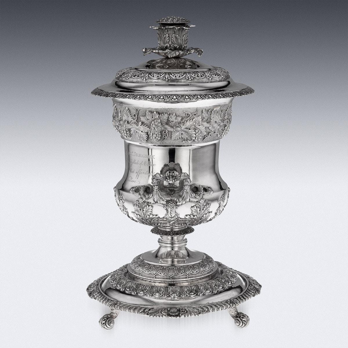 Antique 19th century Indian Colonial solid silver cup and cover on stand, exceptionally heavy and decorative, campana form on a spreading foot, domed lid chased and embossed with foliage and topped with a cast spray of flowers, rim with applied