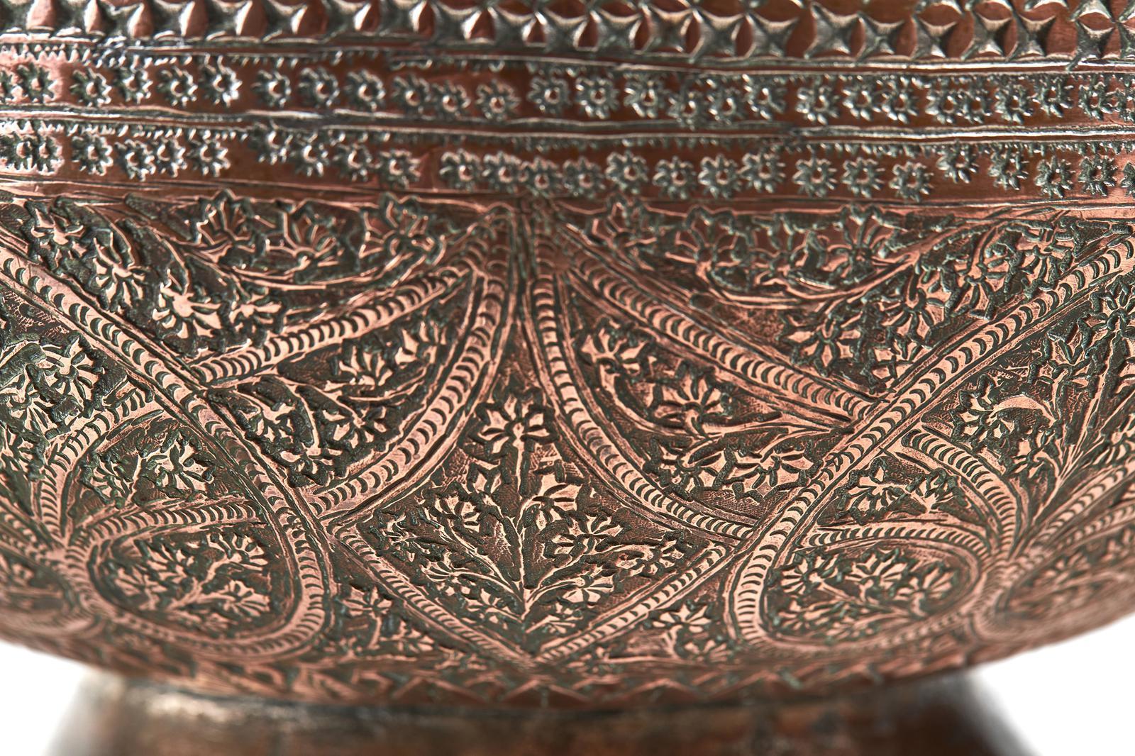19th Century Indian Copper Bowl, having embossed decoration all over and standing on a shallow foot base.