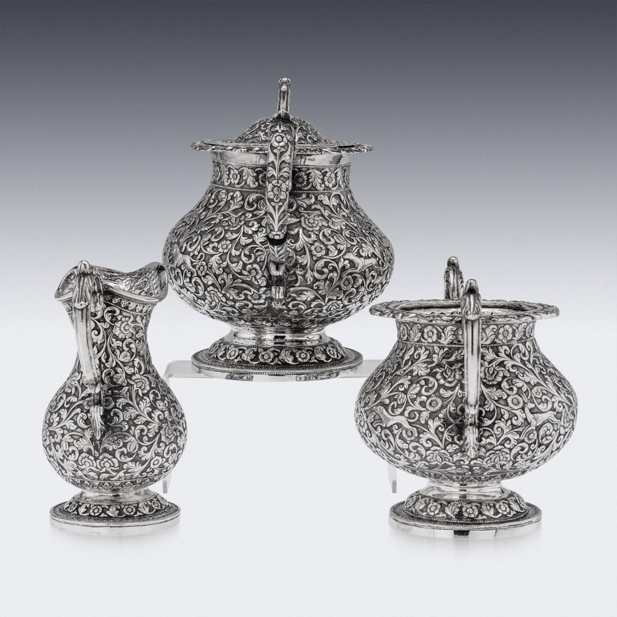 Antique 19th century Indian exceptional solid silver repousse three piece tea set, of pear shape, comprising of a teapot, sugar bowl and cream jug, each piece is profusely and beautifully repousse' decorated with dense scrolling foliage and flowers