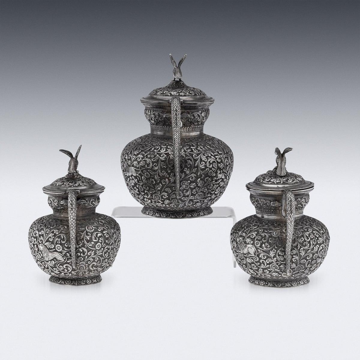 Antique 19th Century rare Indian Kutch style hand crafted three piece solid silver tea set. The set features a teapot, sugar pot and milk jug. All profusely chased with the typical Kutch repoussé foliage, each piece is profusely and beautifully