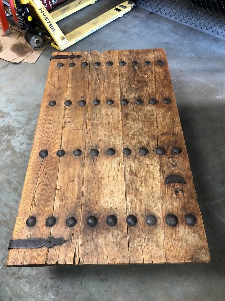 19th Century Indian Door with Iron Accents Made into a Coffee Table For
