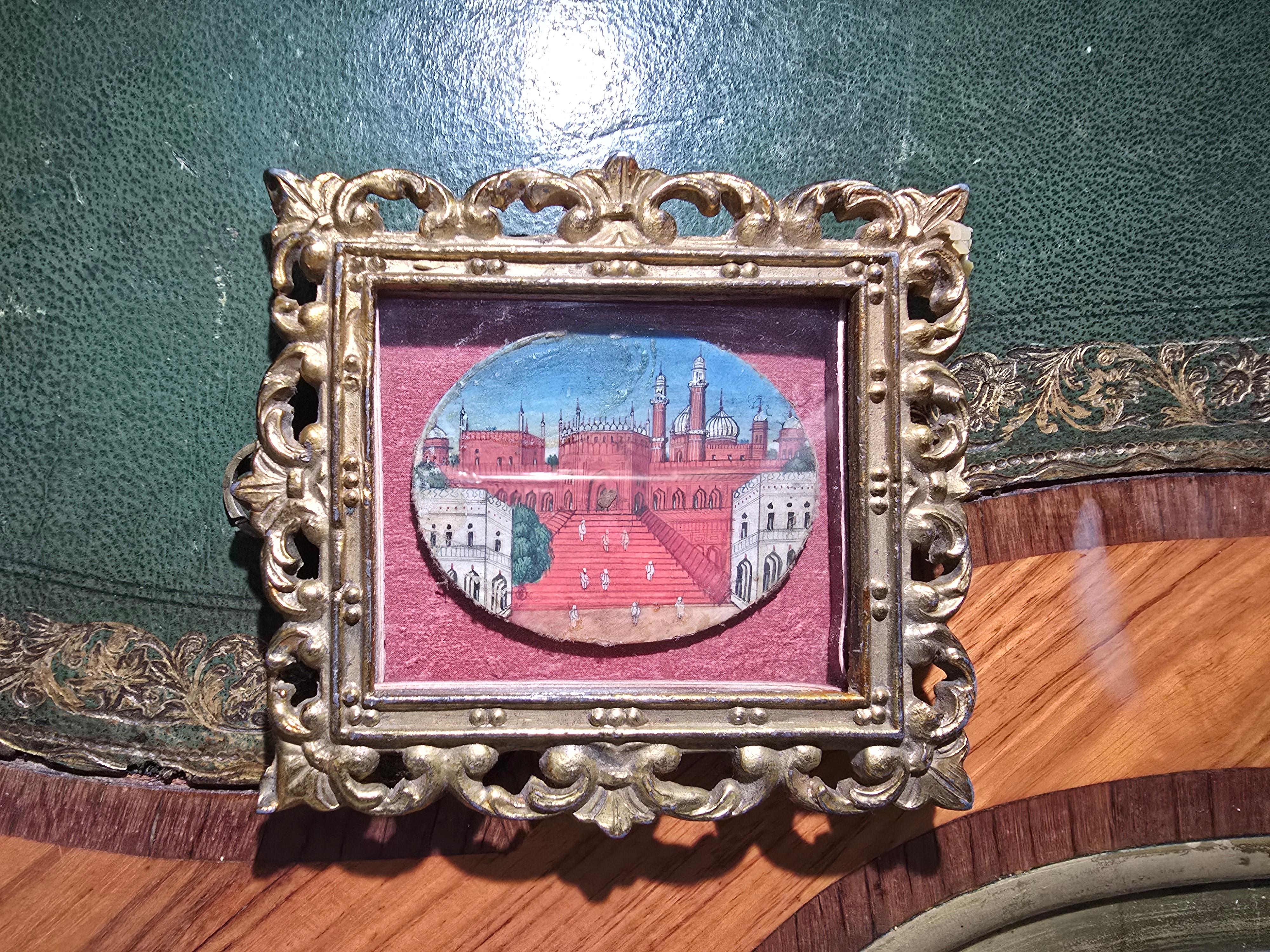 
Exquisite 19th-century oil miniature depicting a traditional Indian subject, finely executed with remarkable attention to detail. The painting captures the elegance and craftsmanship typical of Indian miniature art from the period.

It is set in a