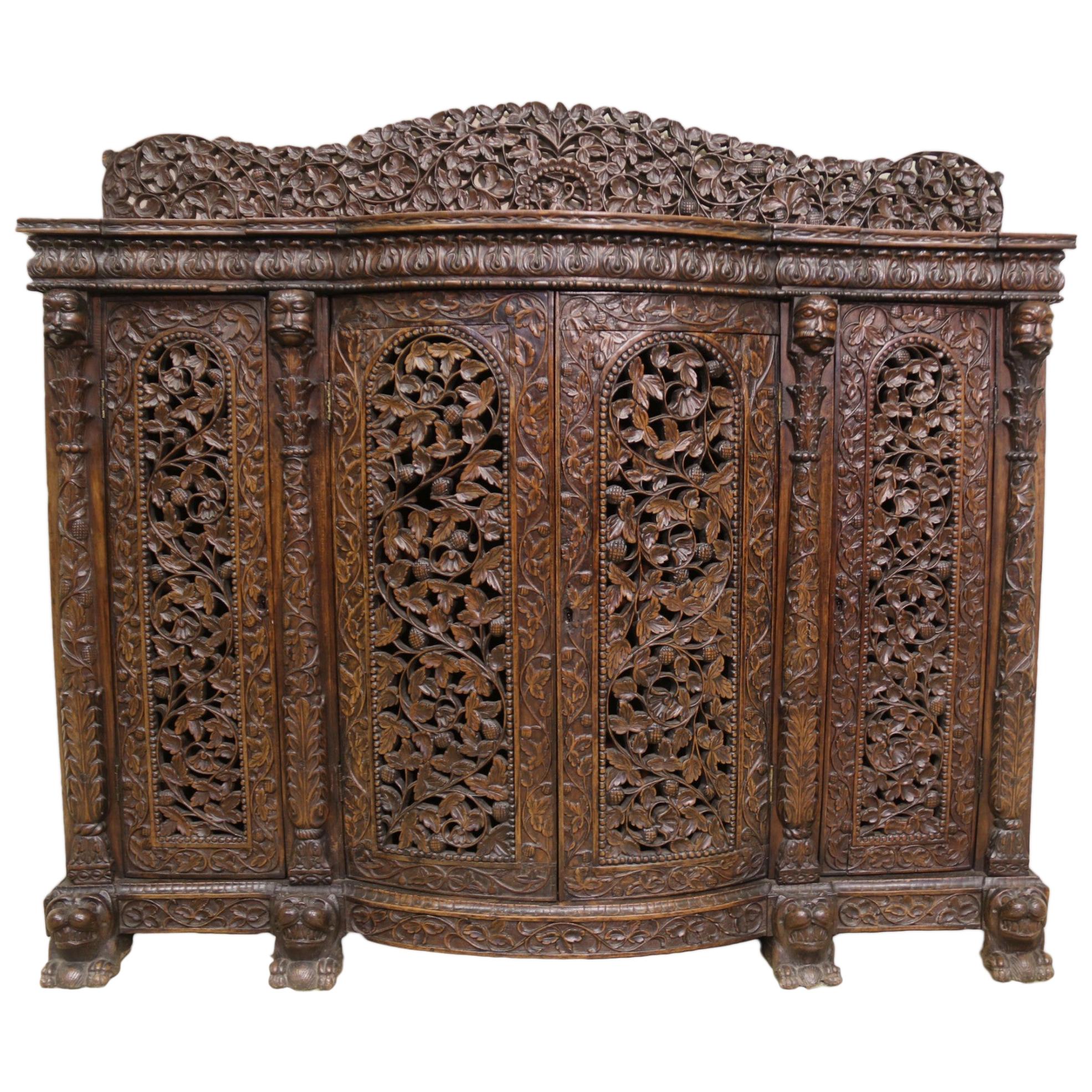 19th Century Indian Ornately Carved Padauk Wood Four-Door Side Cabinet For Sale