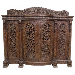 Antique 19th Century Indian Ornately Carved Padauk Wood Four-Door Side Cabinet