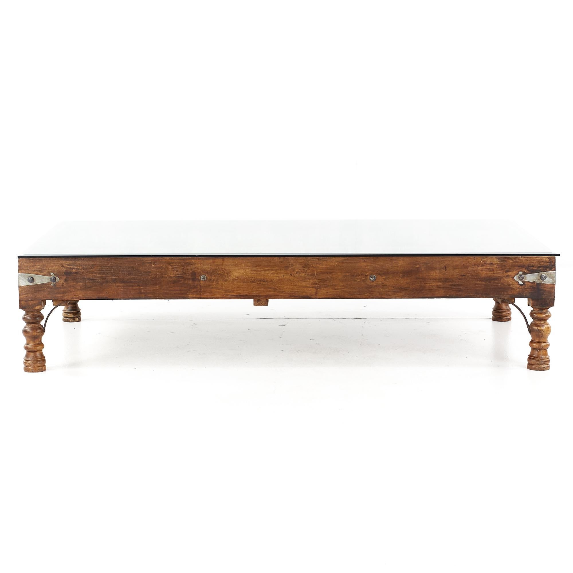 19th Century Indian Paneled Door with Iron Accents Converted to a Coffee Table

This table measures: 72 wide x 39 deep x 16 inches high

About Photos: We take our photos in a controlled lighting studio to show as much detail as possible. We do