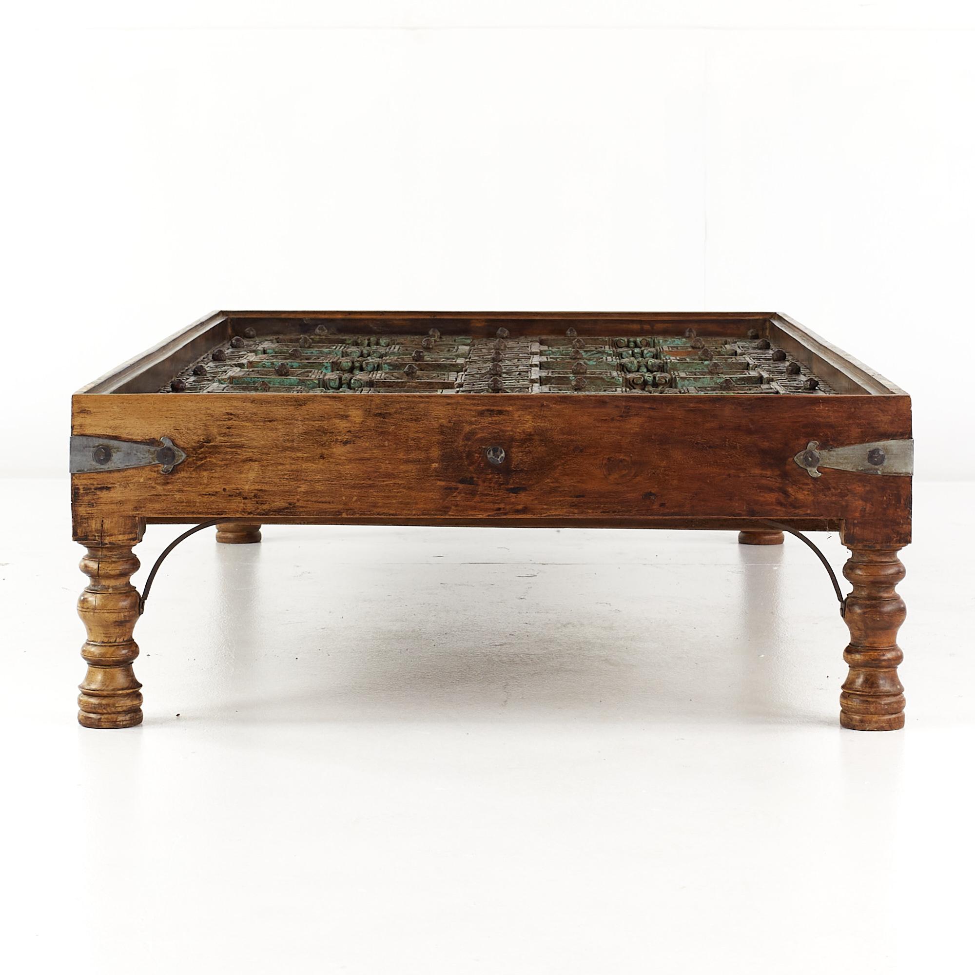 Contemporary 19th Century Indian Paneled Door with Iron Accents Converted to a Coffee Table