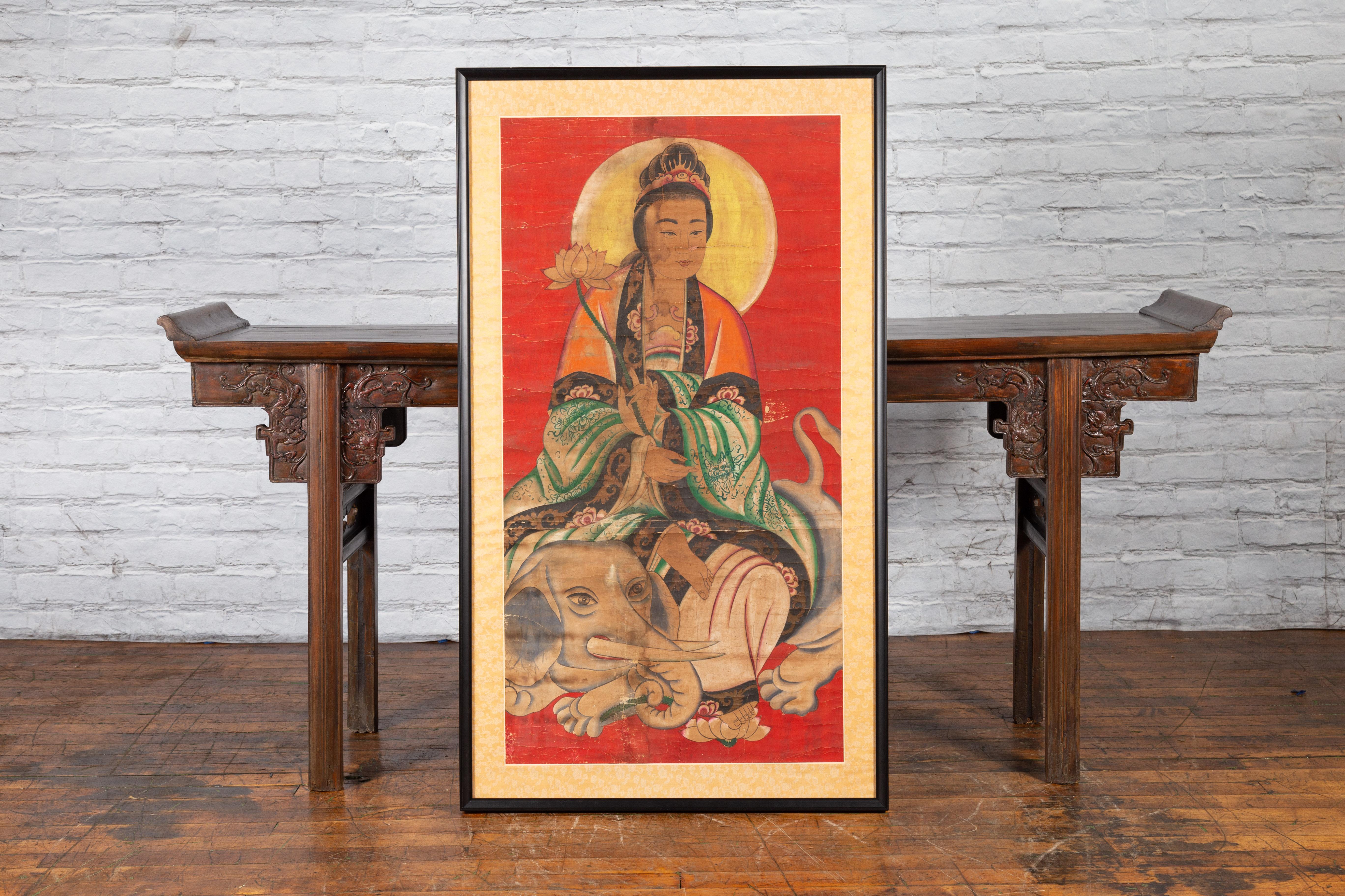 An antique Indian print from the 19th century depicting Guanyin the Bodhisattva of Compassion. Created in India during the 19th century, this large print features Guanyin the Bodhisattva of Compassion, sitting on a noble elephant. Holding a lotus
