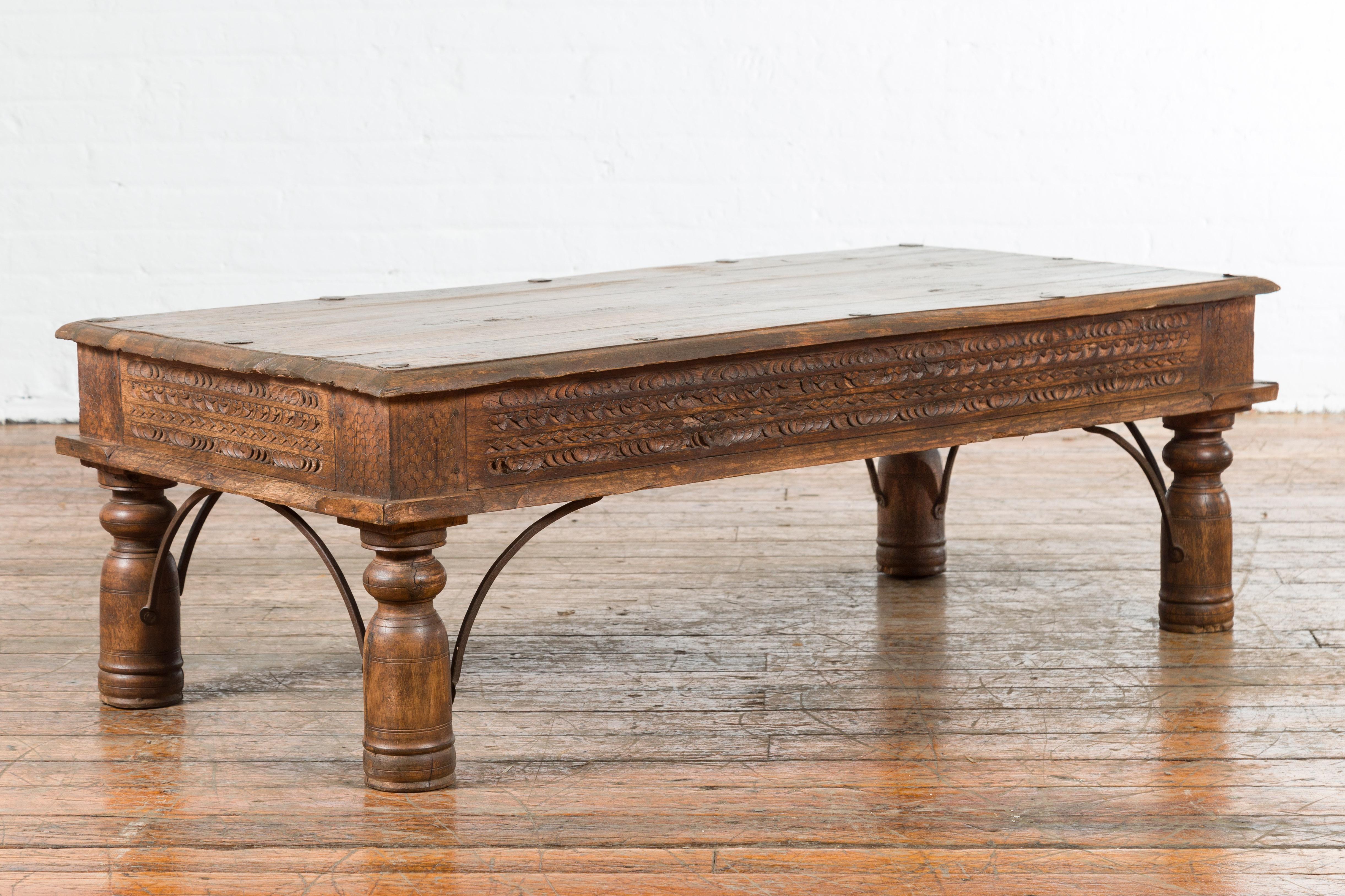 19th Century Indian Rustic Coffee Table with Carved Apron and Iron Accents 5