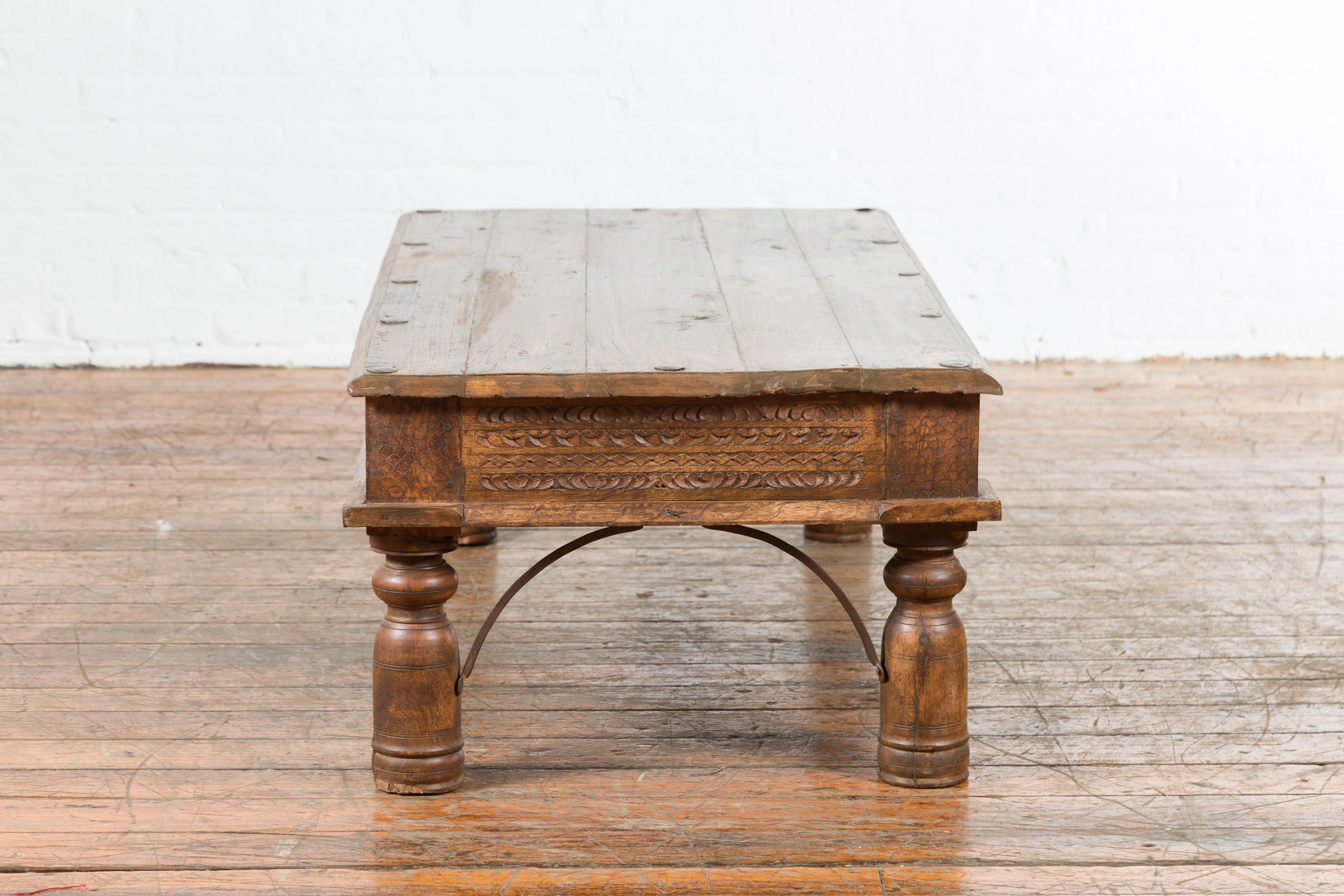 19th Century Indian Rustic Coffee Table with Carved Apron and Iron Accents 6
