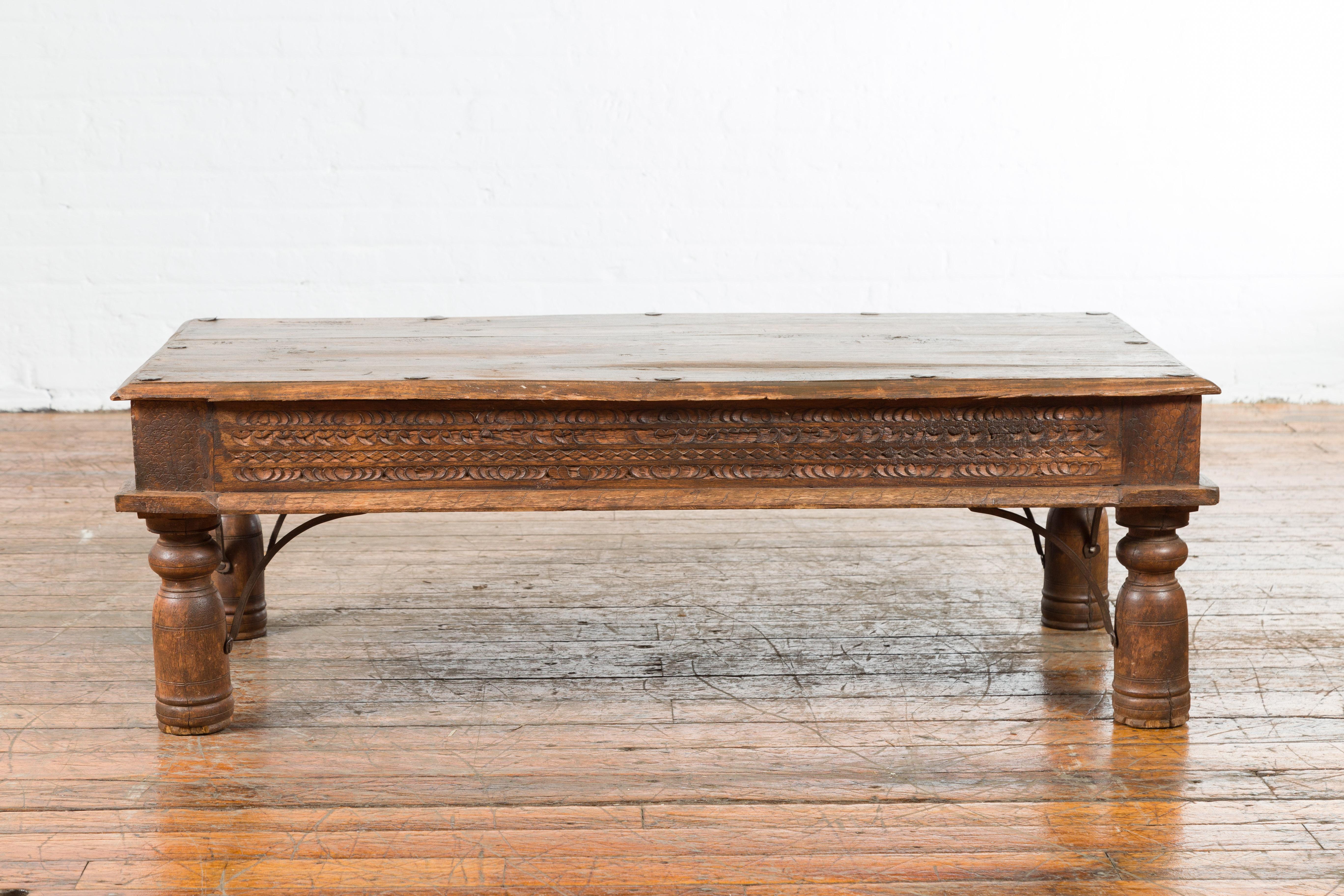 19th Century Indian Rustic Coffee Table with Carved Apron and Iron Accents 7