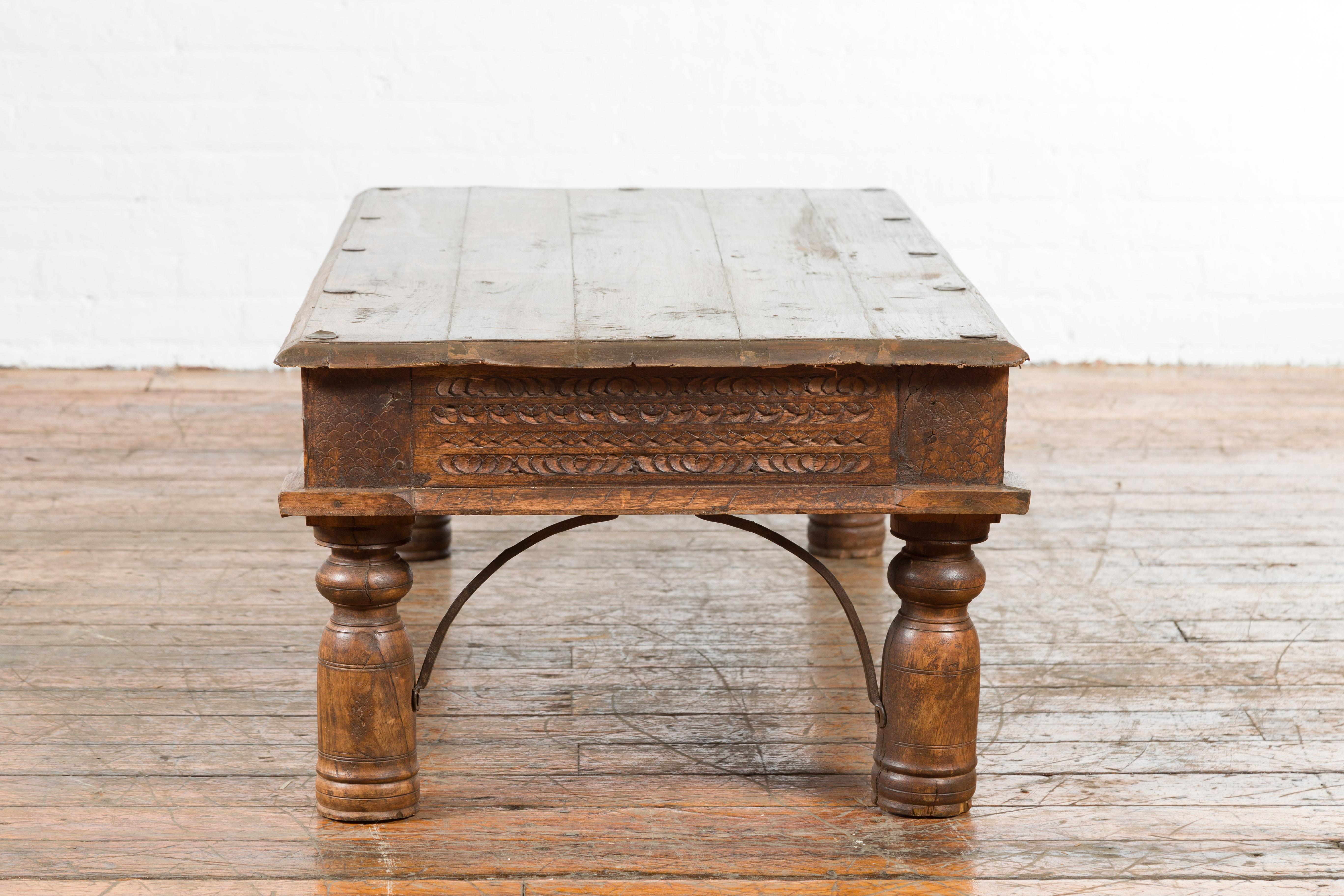 19th Century Indian Rustic Coffee Table with Carved Apron and Iron Accents 8