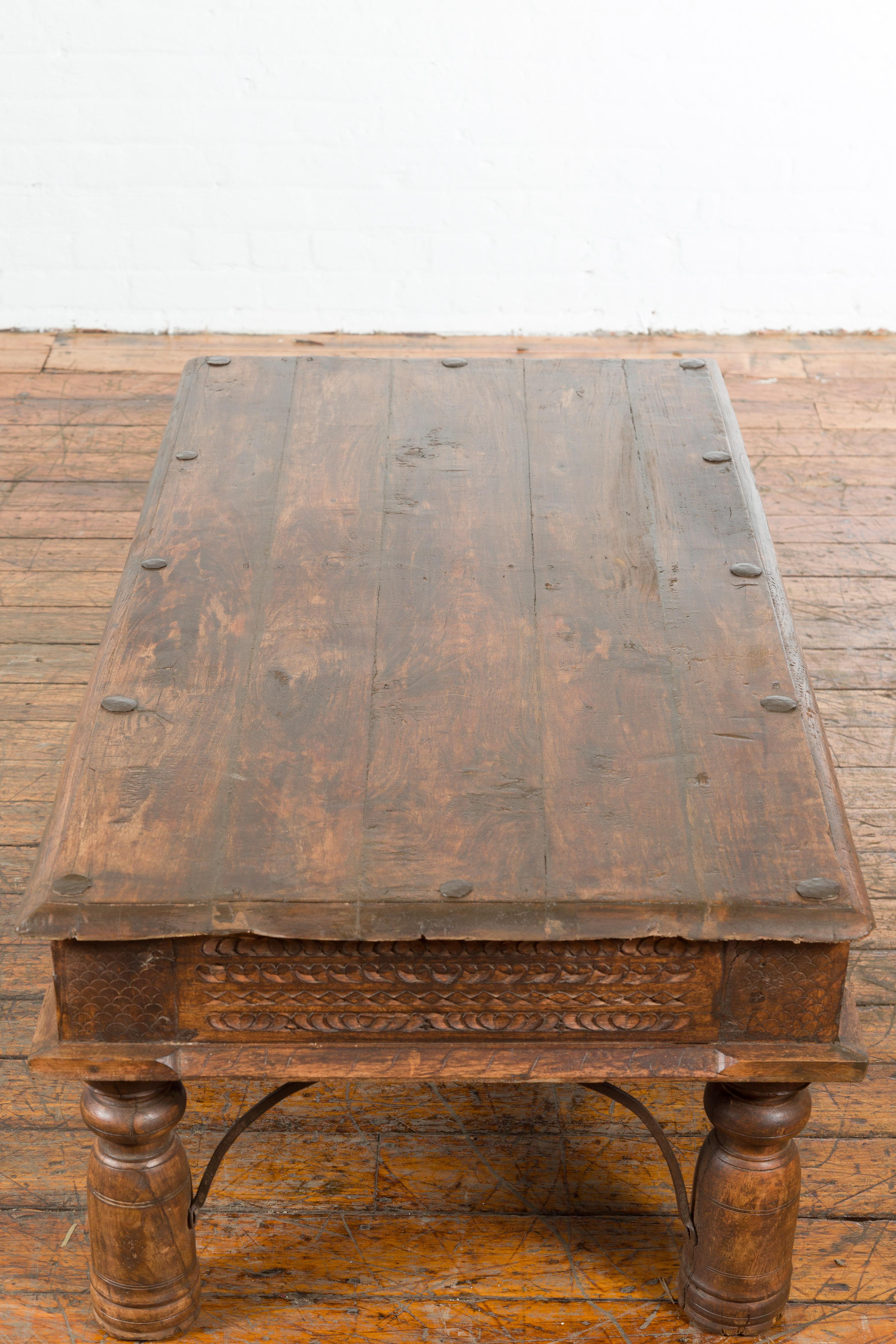 19th Century Indian Rustic Coffee Table with Carved Apron and Iron Accents 9