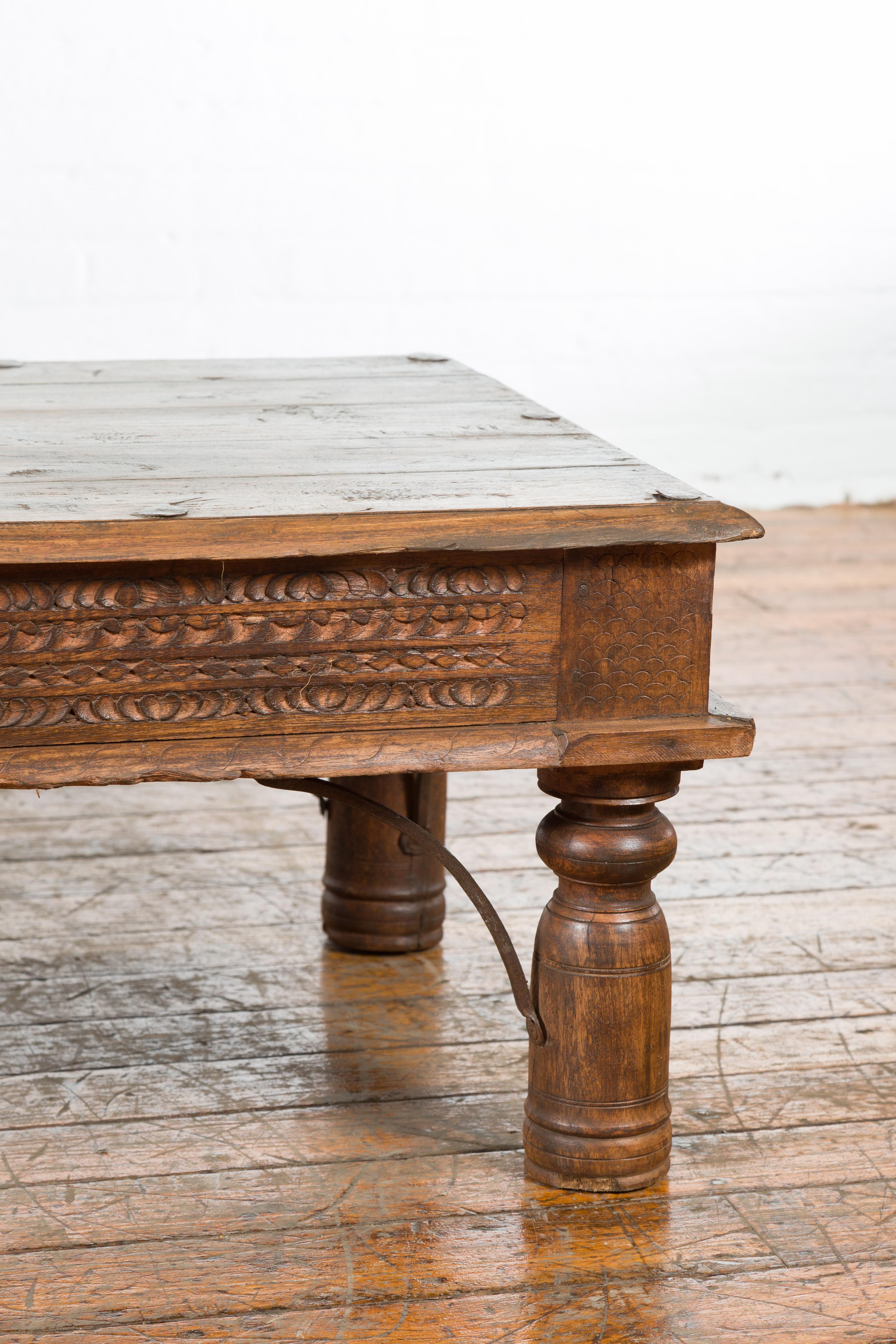 19th Century Indian Rustic Coffee Table with Carved Apron and Iron Accents 1