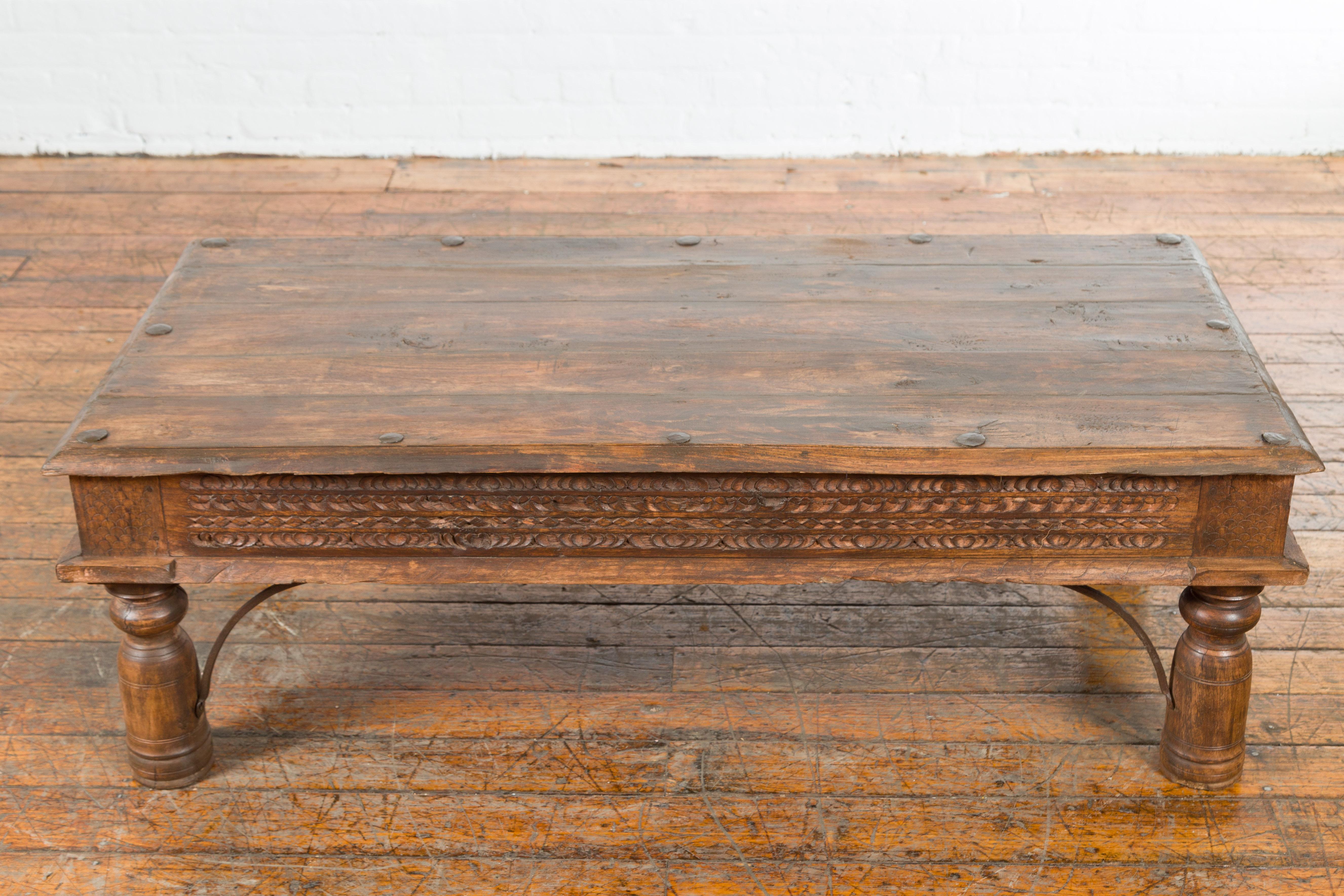 19th Century Indian Rustic Coffee Table with Carved Apron and Iron Accents 3