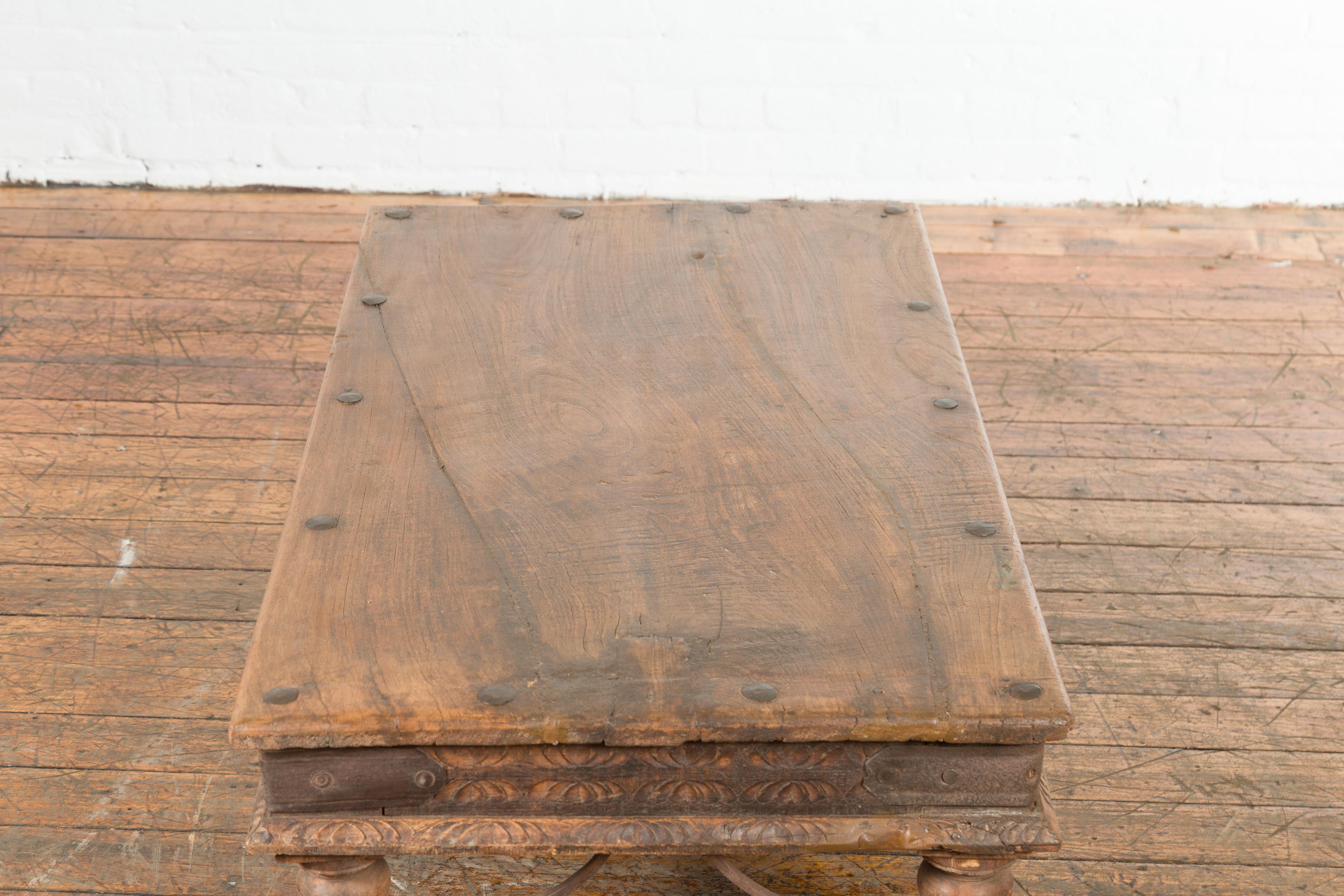 19th Century Indian Rustic Coffee Table with Iron Accents and Carved Apron 4