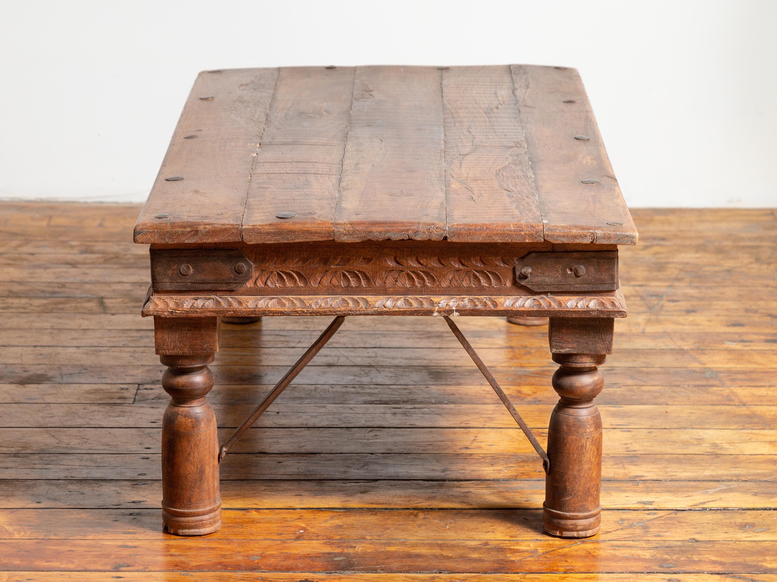 19th Century Indian Rustic Low Coffee Table with Carved Apron and Iron Accents 4