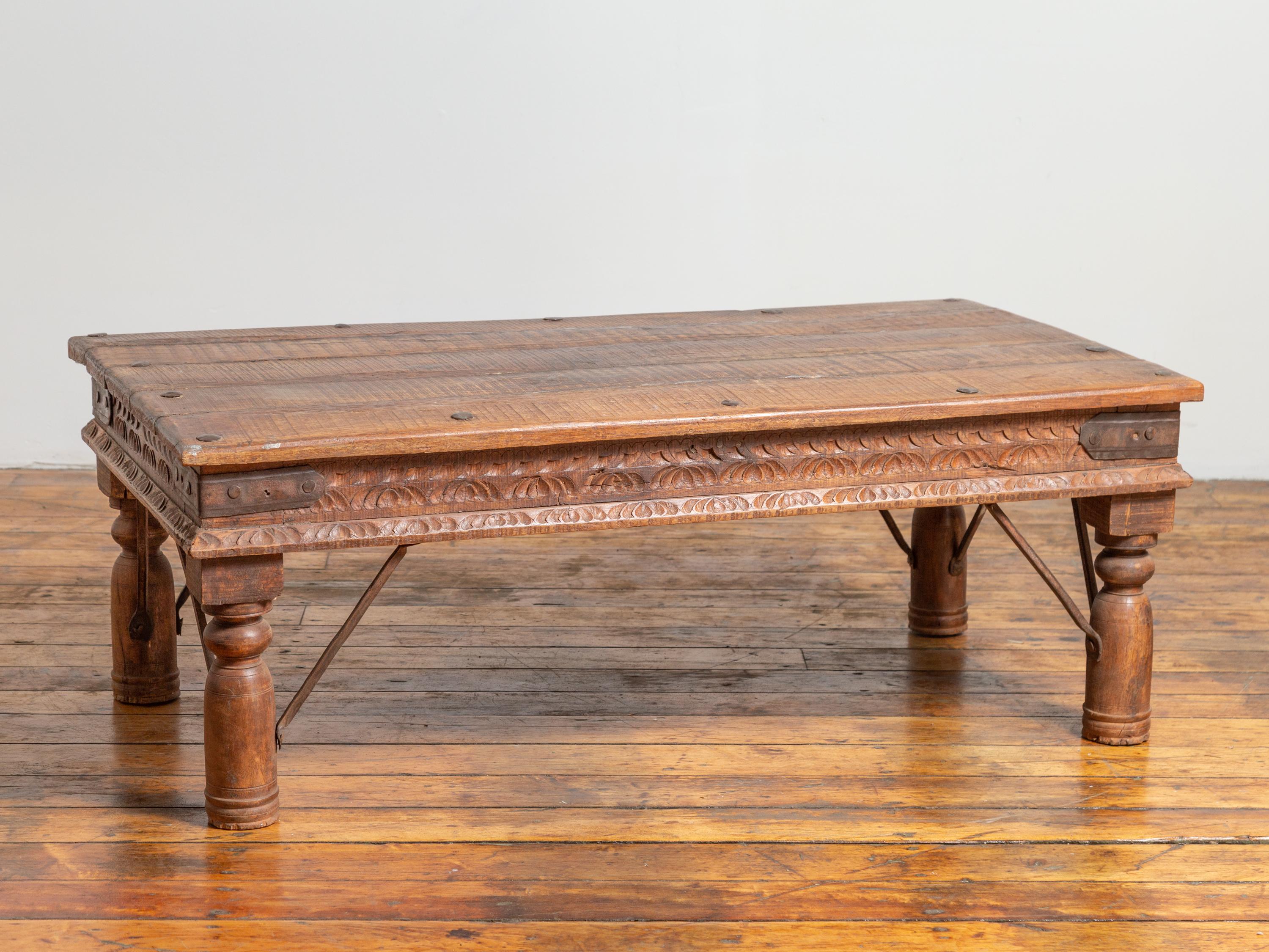 19th Century Indian Rustic Low Coffee Table with Carved Apron and Iron Accents 1