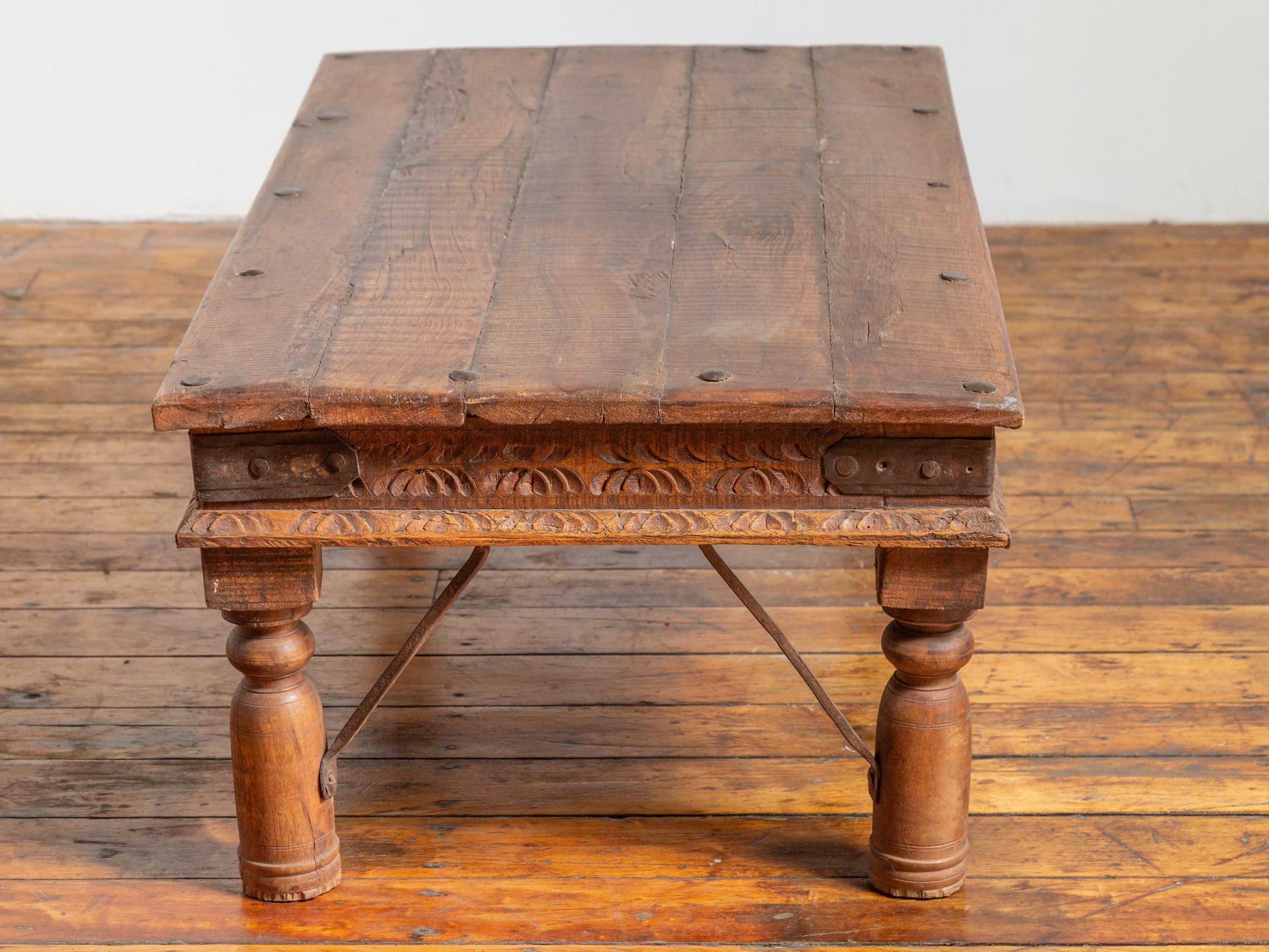 19th Century Indian Rustic Low Coffee Table with Carved Apron and Iron Accents 2