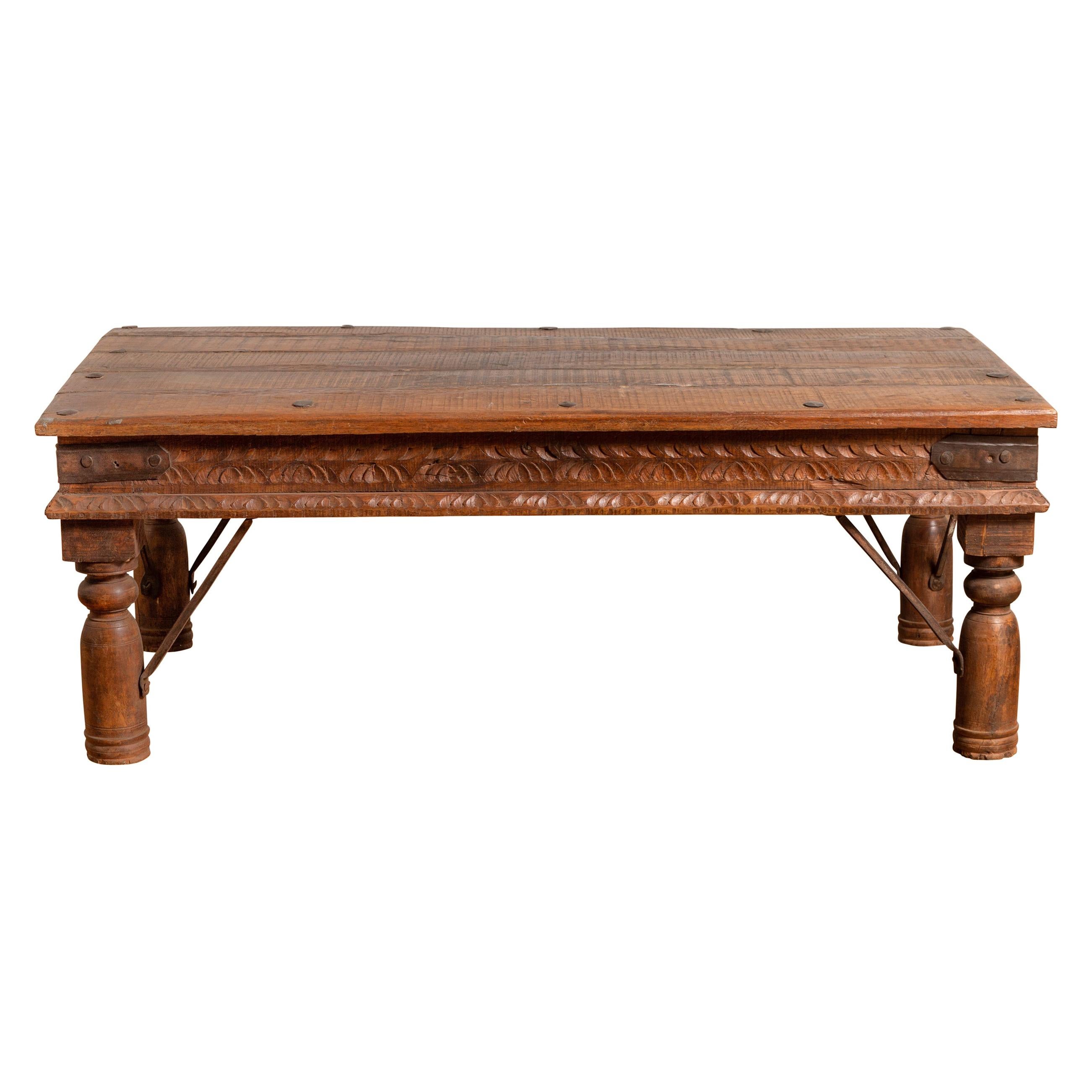 19th Century Indian Rustic Low Coffee Table with Carved Apron and Iron Accents