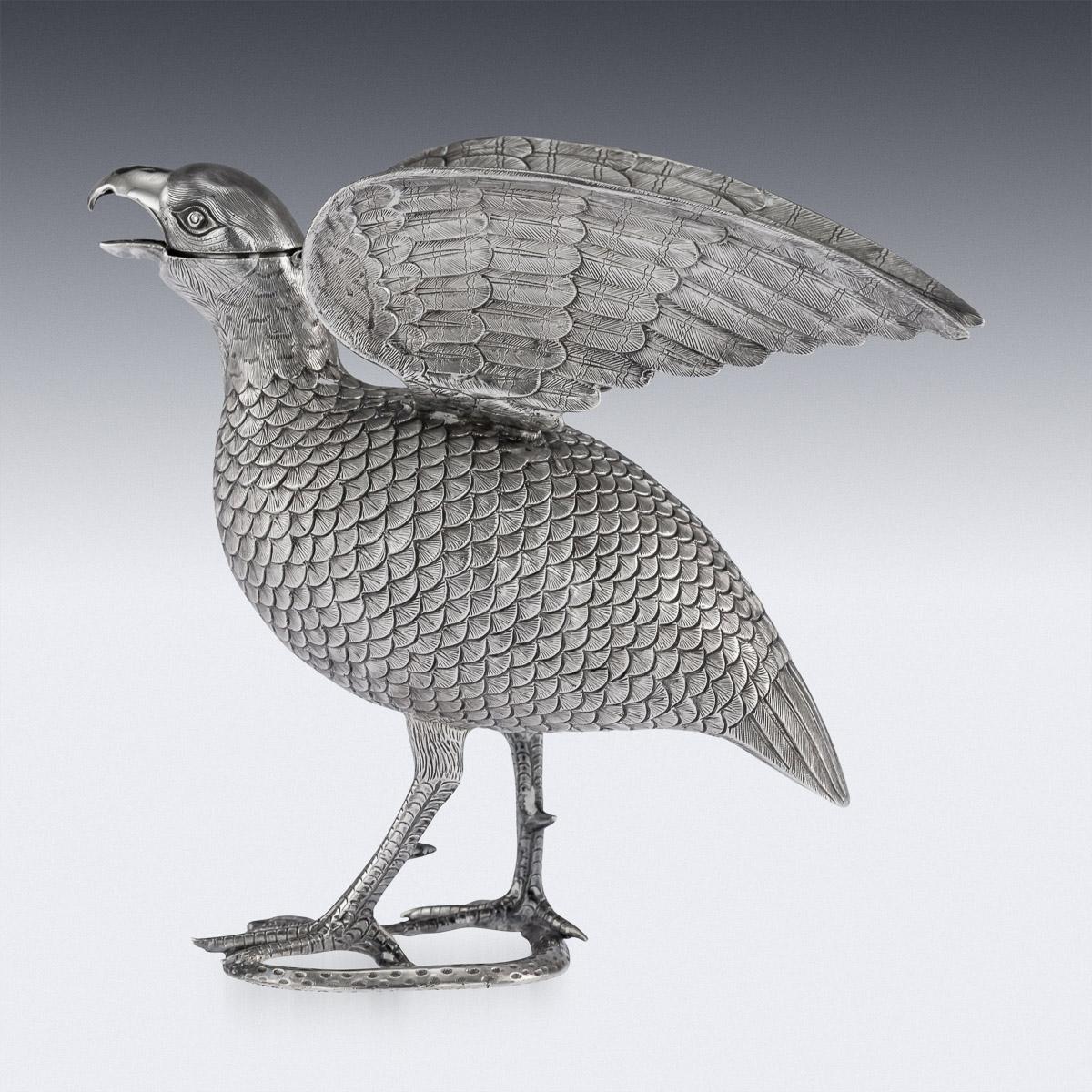 Antique 19th century exceptionally rare Indian Colonial solid silver cream jug modelled as a black francolin killing a snake, the feathers finely engraved, with a hinged head and spread wings. Hallmarked 'O.M Bhuj' under the snake for Oomersi Mawji,
