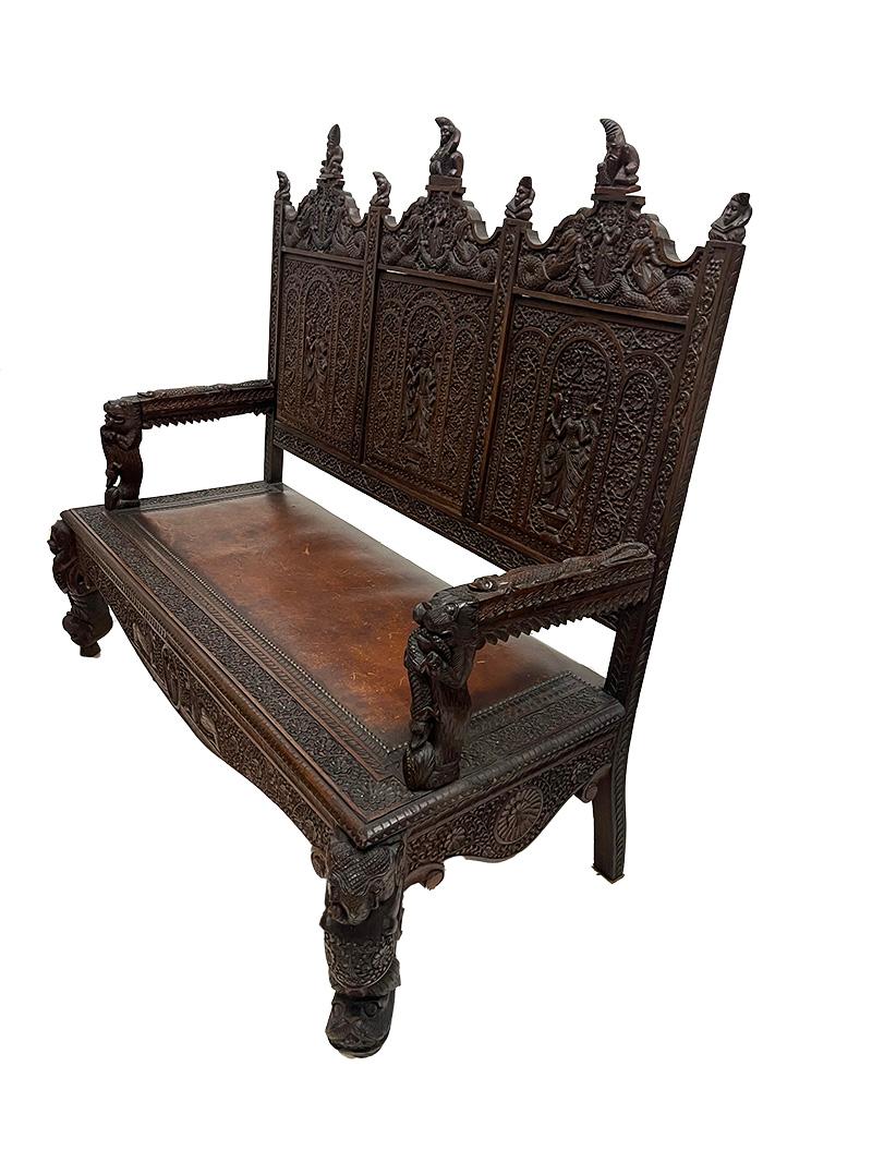 19th Century Indian sofa

19th Century Indian sofa, richly hand-carved. The coconut wooden sofa have beautiful scenes of Buddhist Gods, animals and floral decor. On top of the chairs figures of Sadhu, The backrest with floral pattern and the Gods