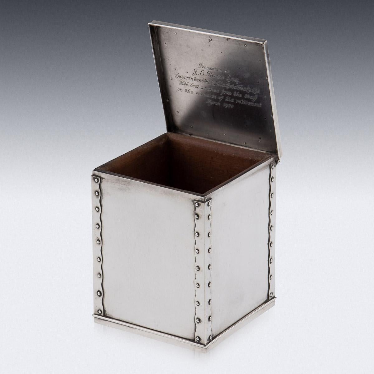 19th Century Indian colonial silver tea caddy shaped as a tea chest. Of square form, imitating a tea chest, with metal corner brackets and rivets, with a hinged lid and wood lined interior. Inside lid inscribed 'Presented to J.S Ross Esq,