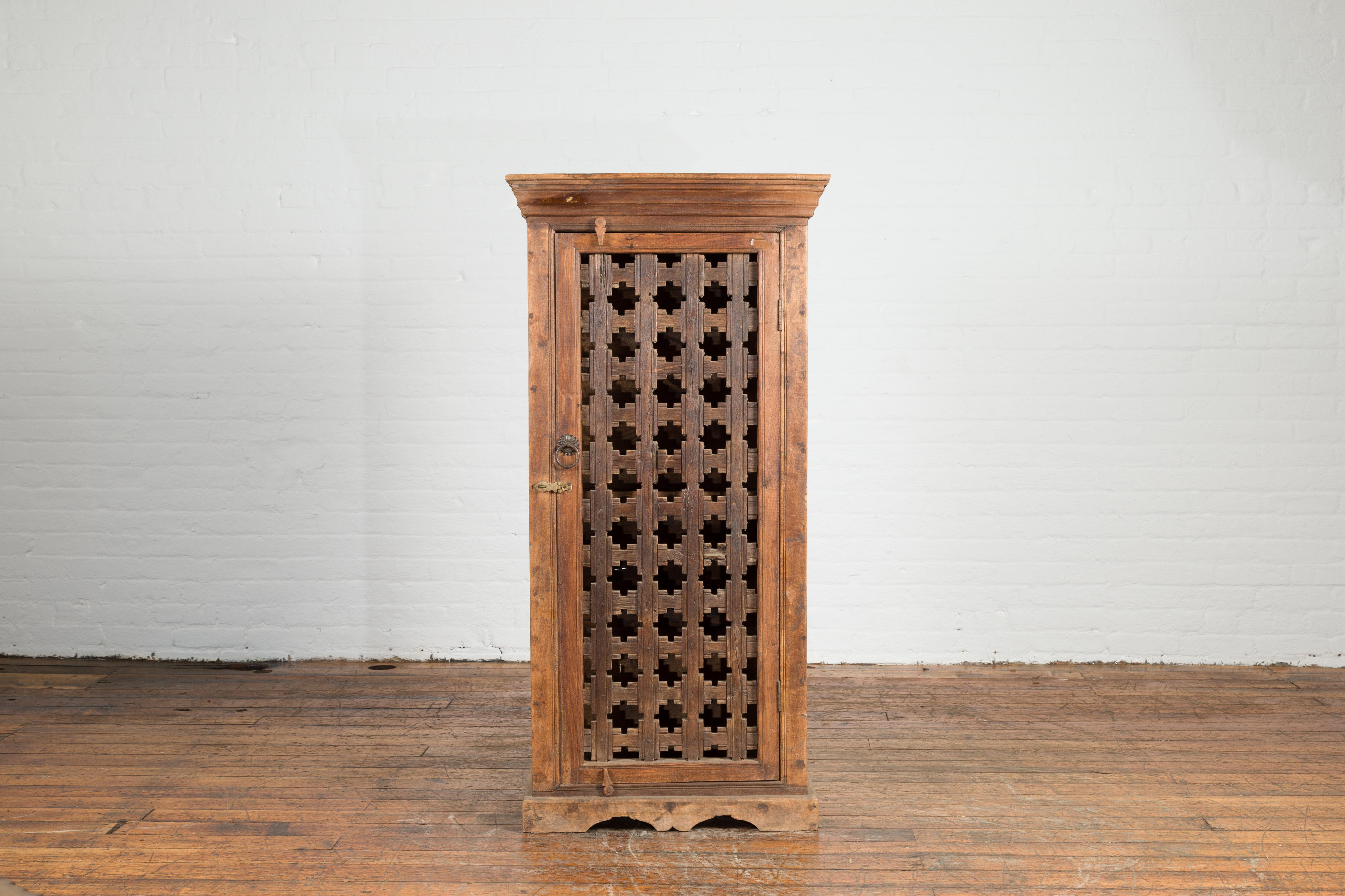 Rustic 19th Century Indian Wooden Cabinet with Single Fretwork Door and Brass Handle For Sale