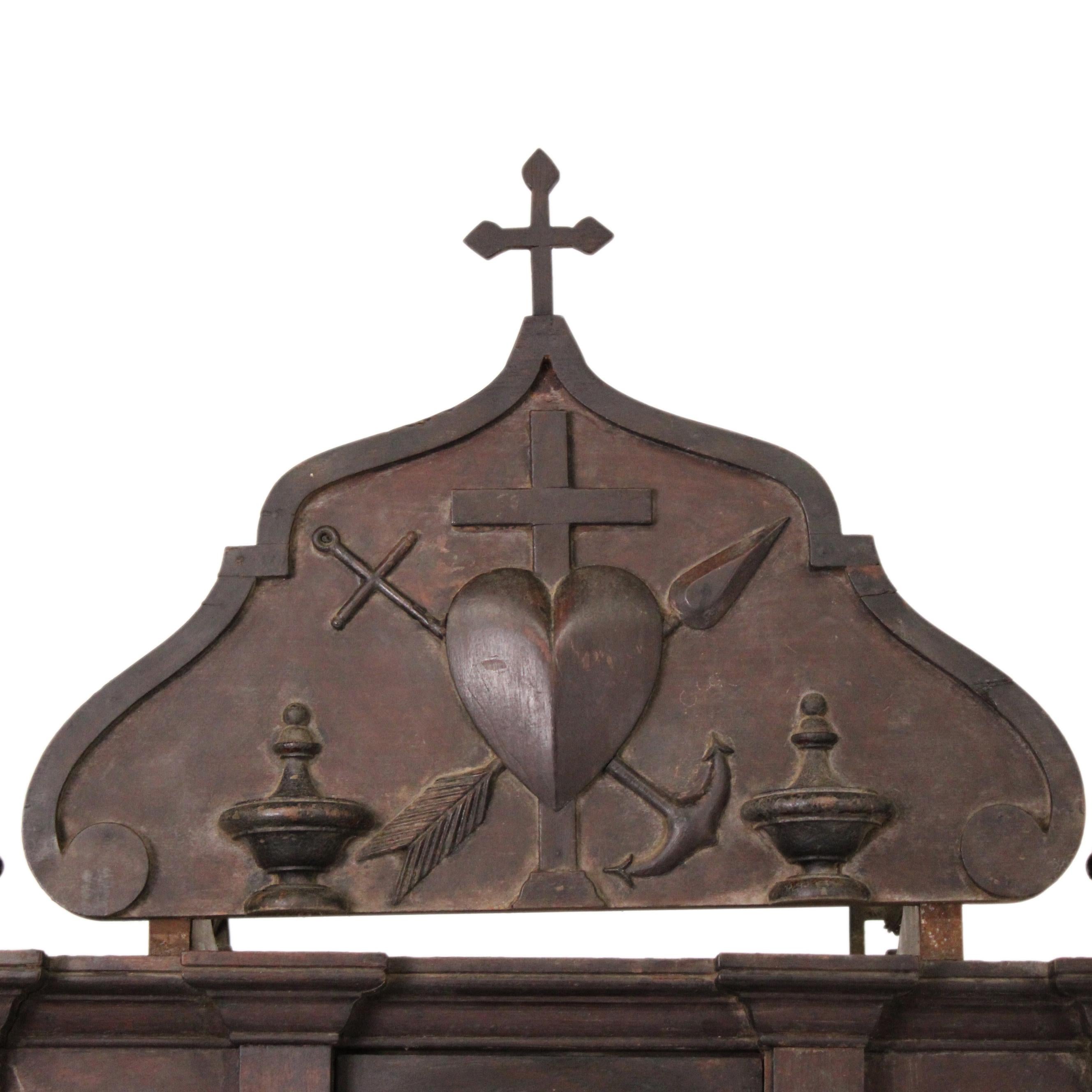 This 19th-century Indo-Portuguese altar was masterfully crafted from rich rosewood and crowned with a beautifully carved cross at the pinnacle. This exceptional piece exemplifies the harmonious blend of European ecclesiastical design and Indian