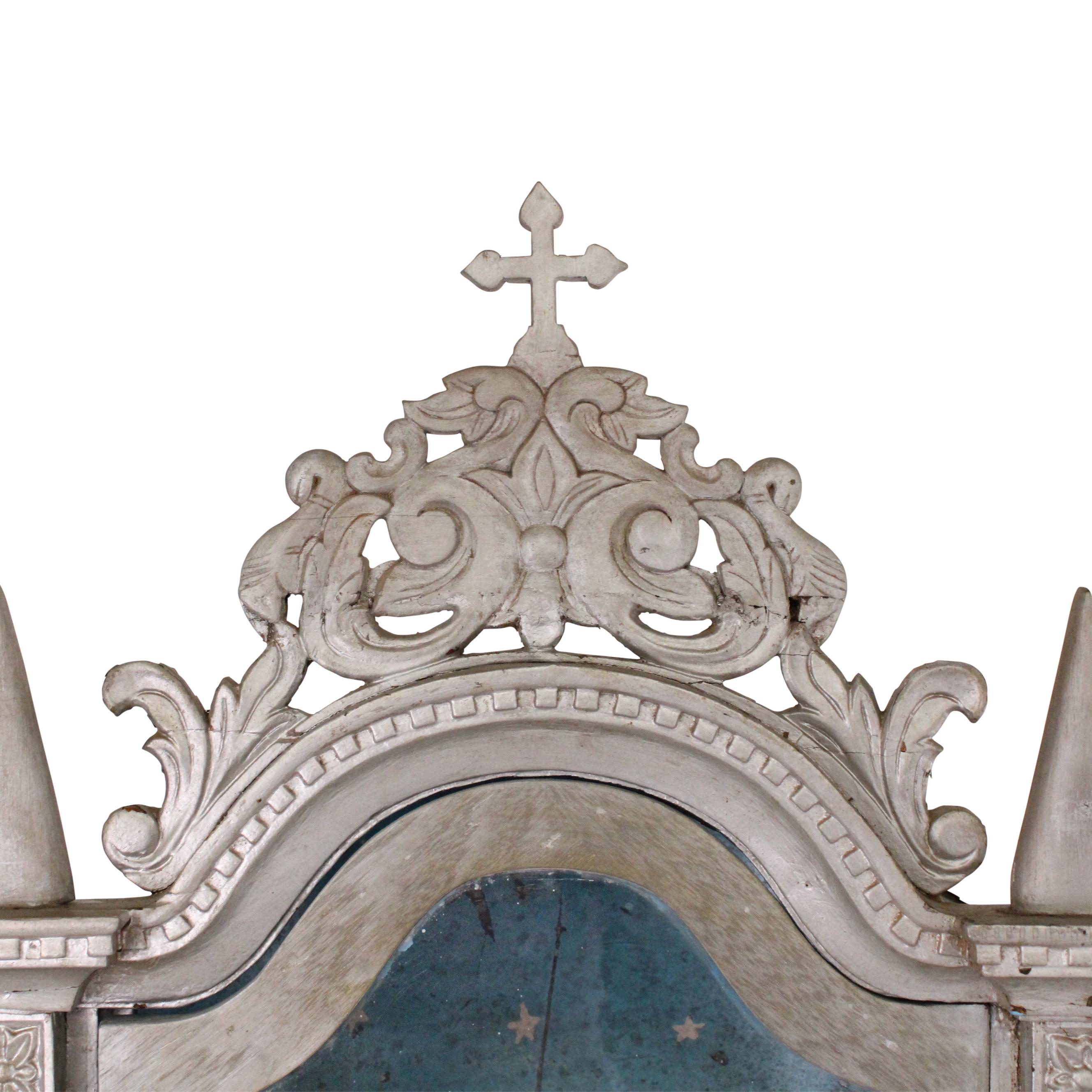 An incredibly gorgeous 19th century altar from Goa. This Indo-Portuguese piece is crafted from rosewood and reflects the unique blend of Indian and Portuguese artistic influences characteristic of that era. The altar has its original paint with a