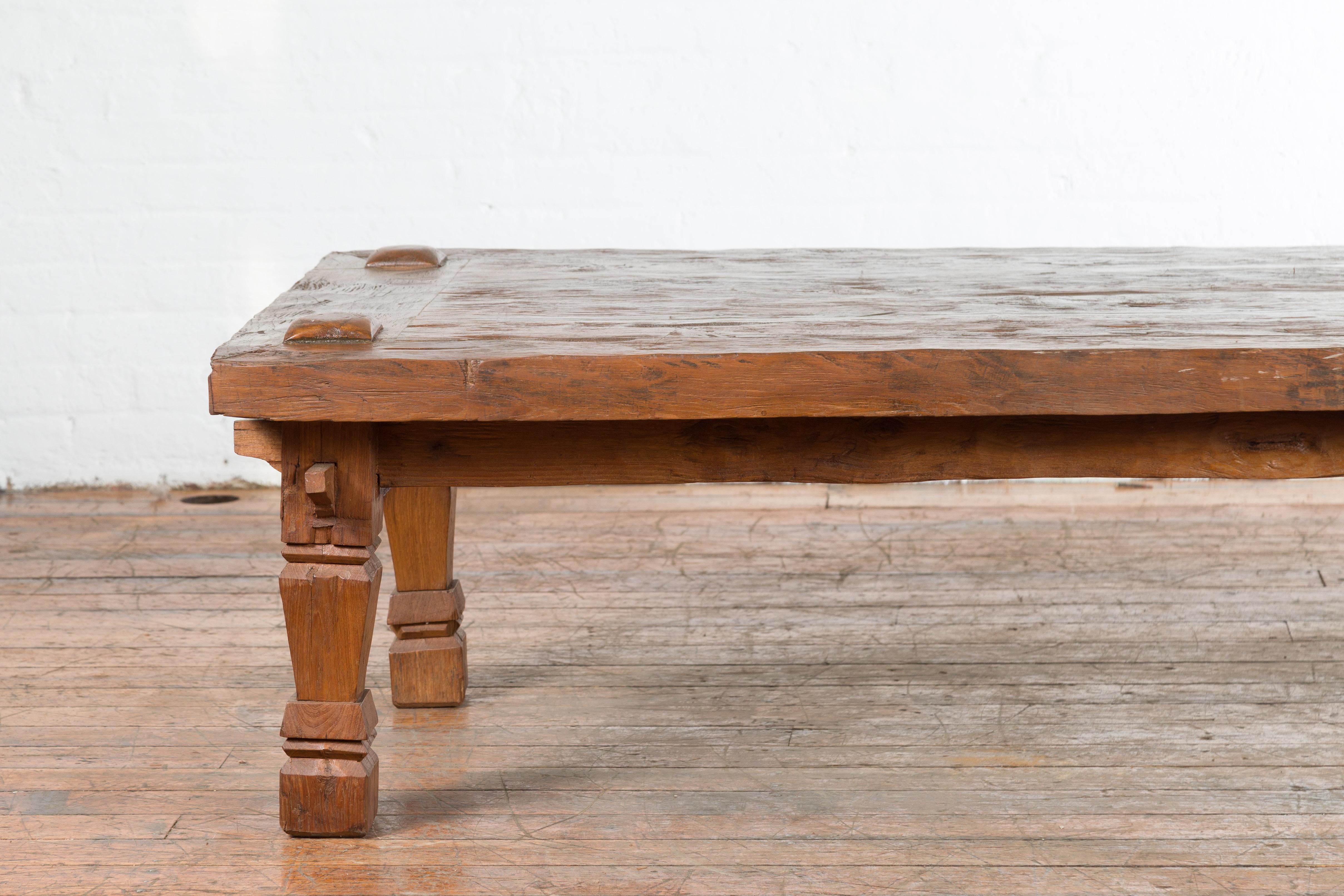 19th Century Indonesian Madurese Coffee Table with Carved Legs and Raised Joints In Good Condition For Sale In Yonkers, NY